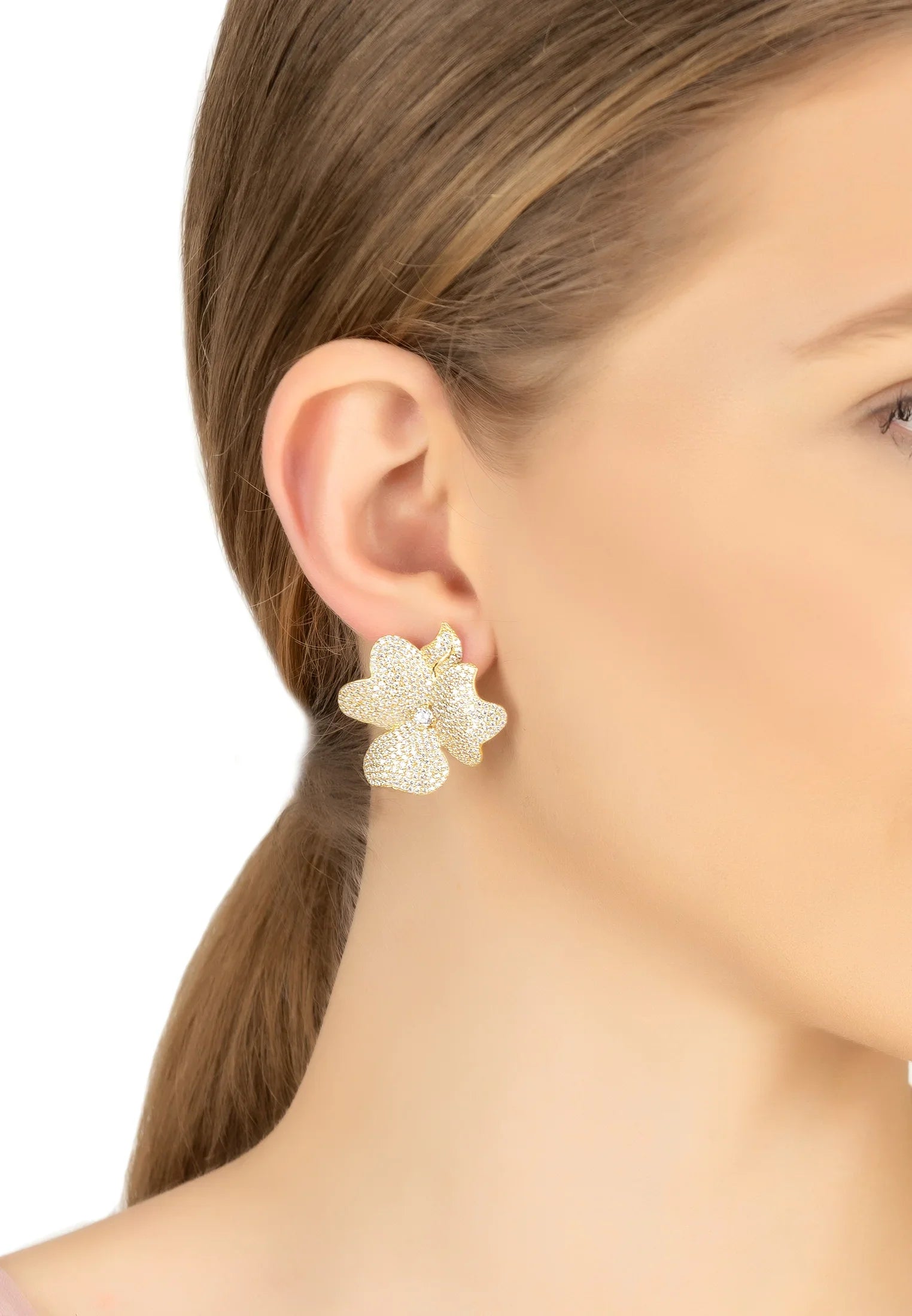 The earring worn by a model.