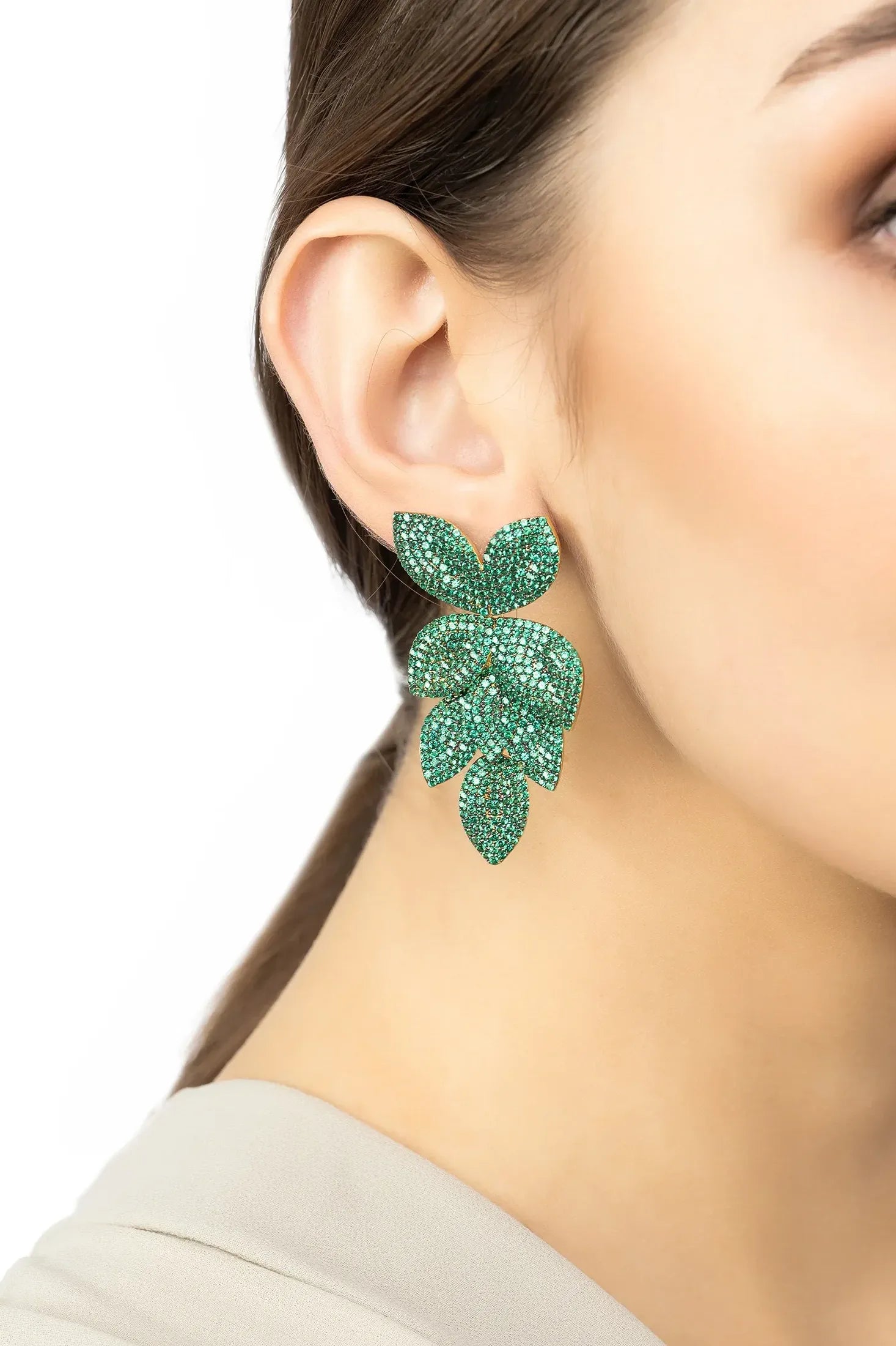 The earring worn by a model.