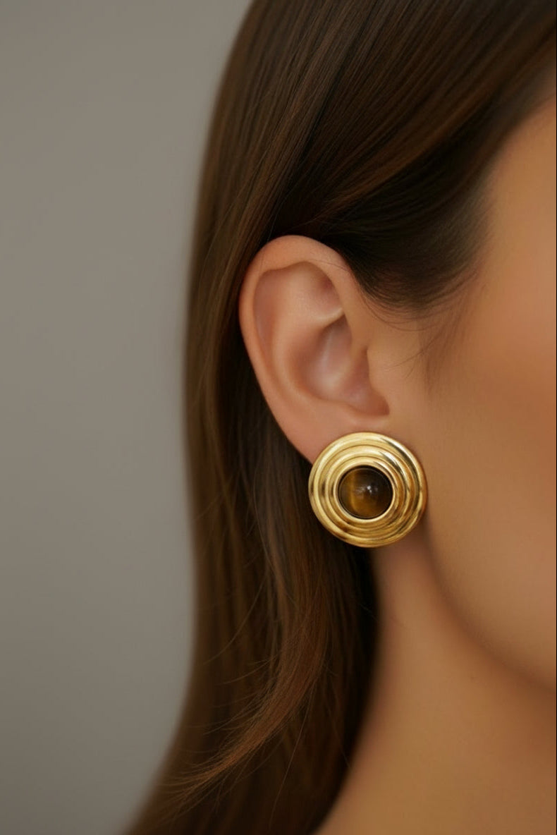 The earring worn by a model.