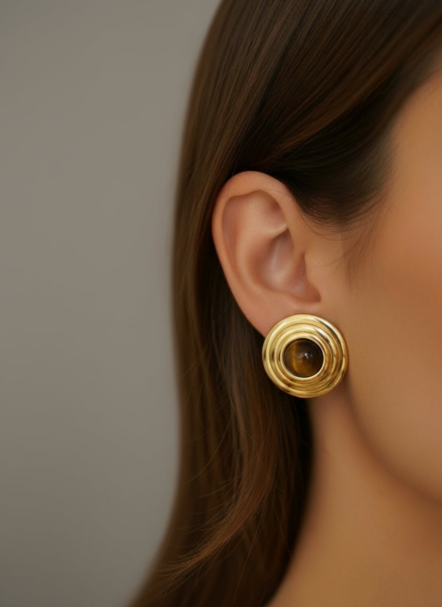 The earring worn by a model.
