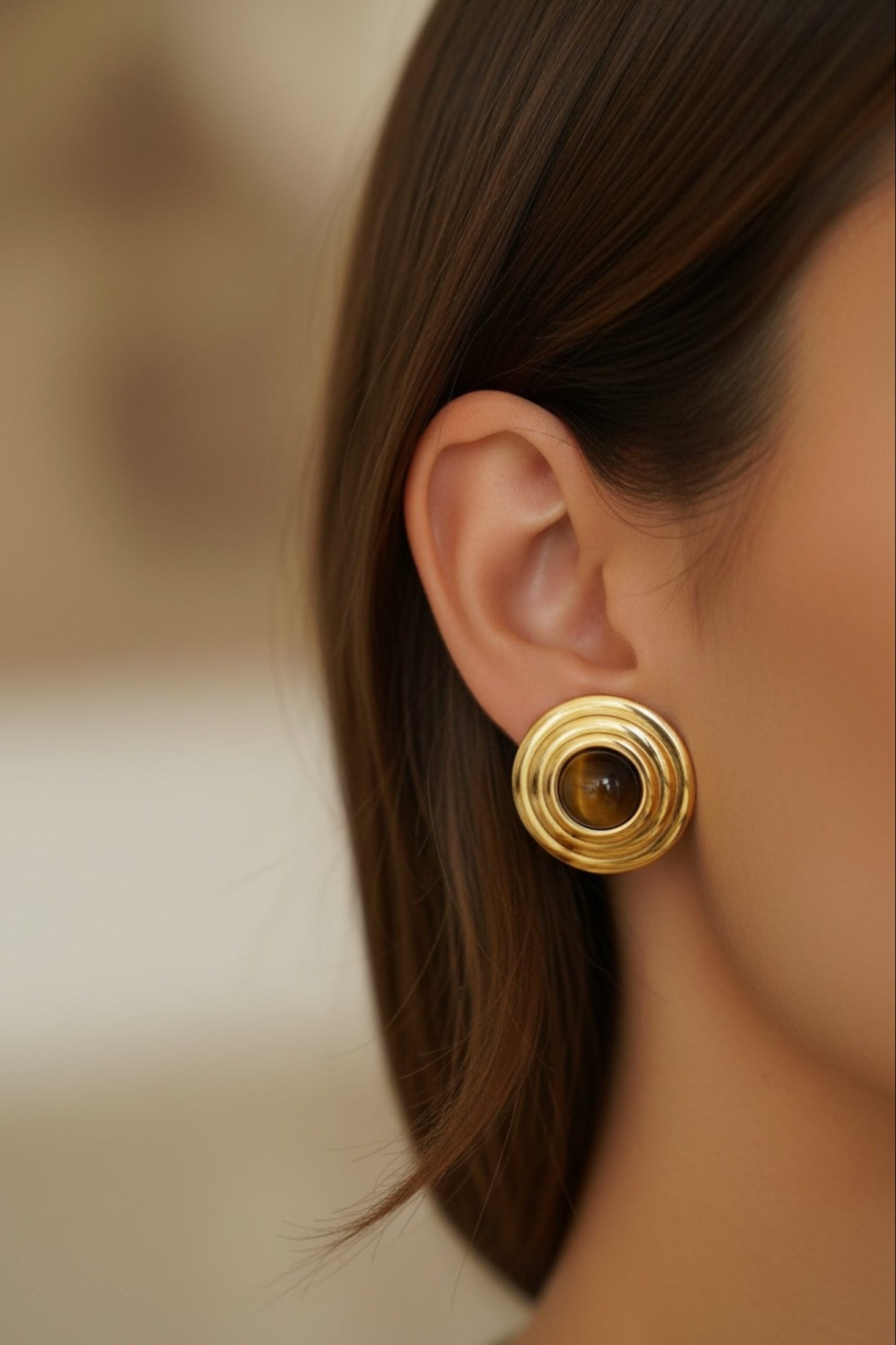 The earring worn by a model.
