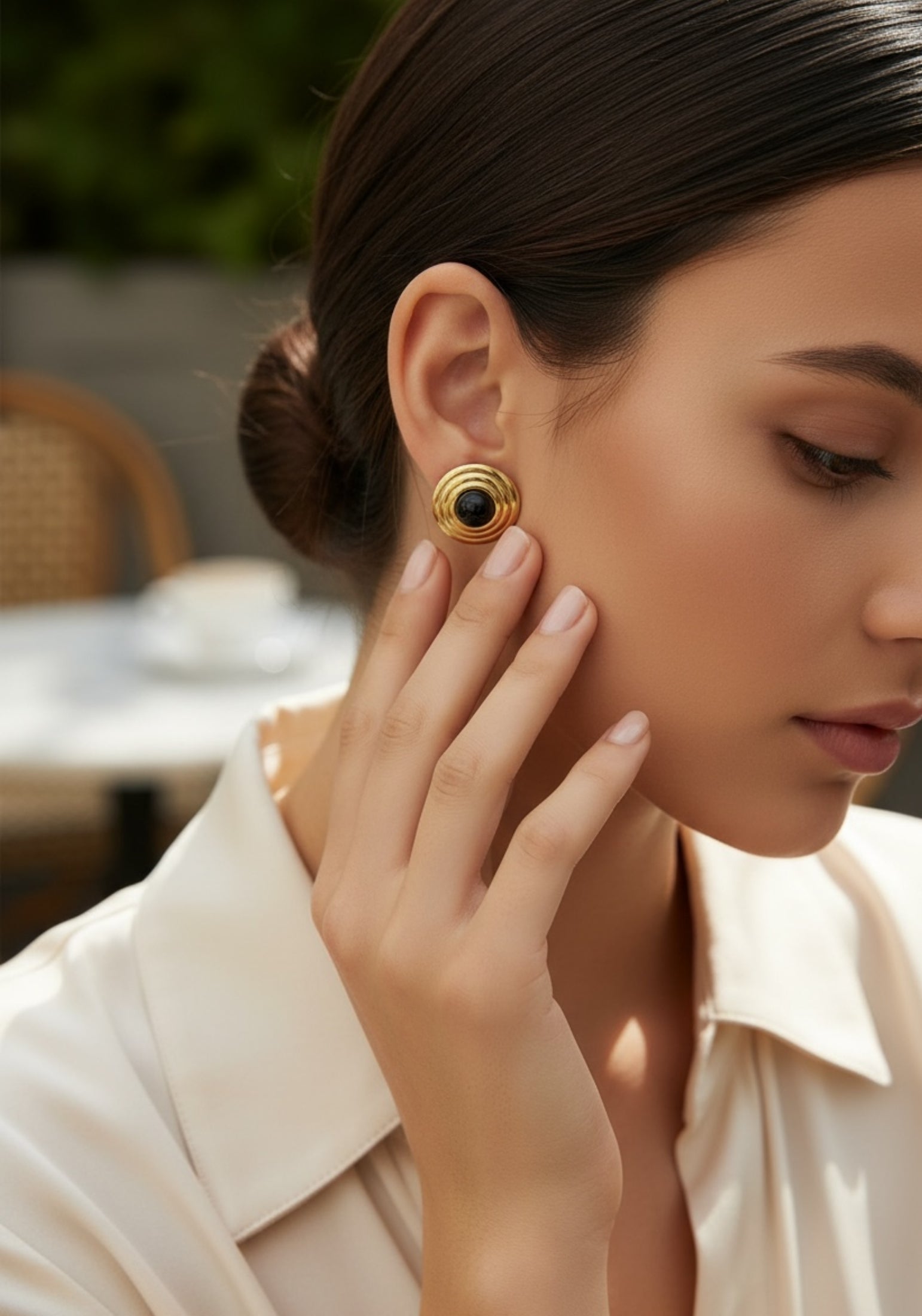 The earring worn by a model.