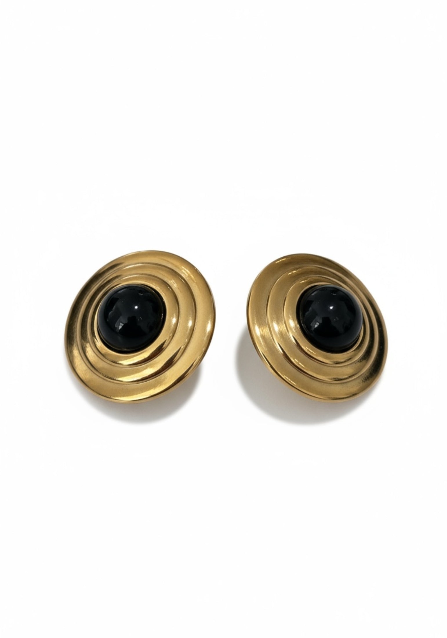 Gold and onyx stud earrings.