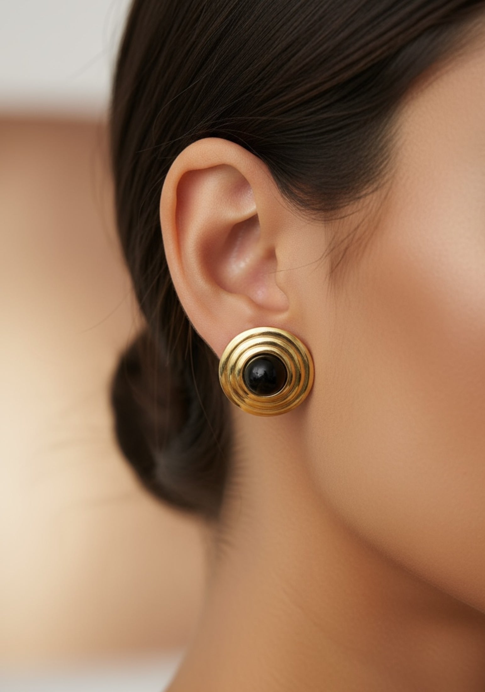 The earring worn by a model.