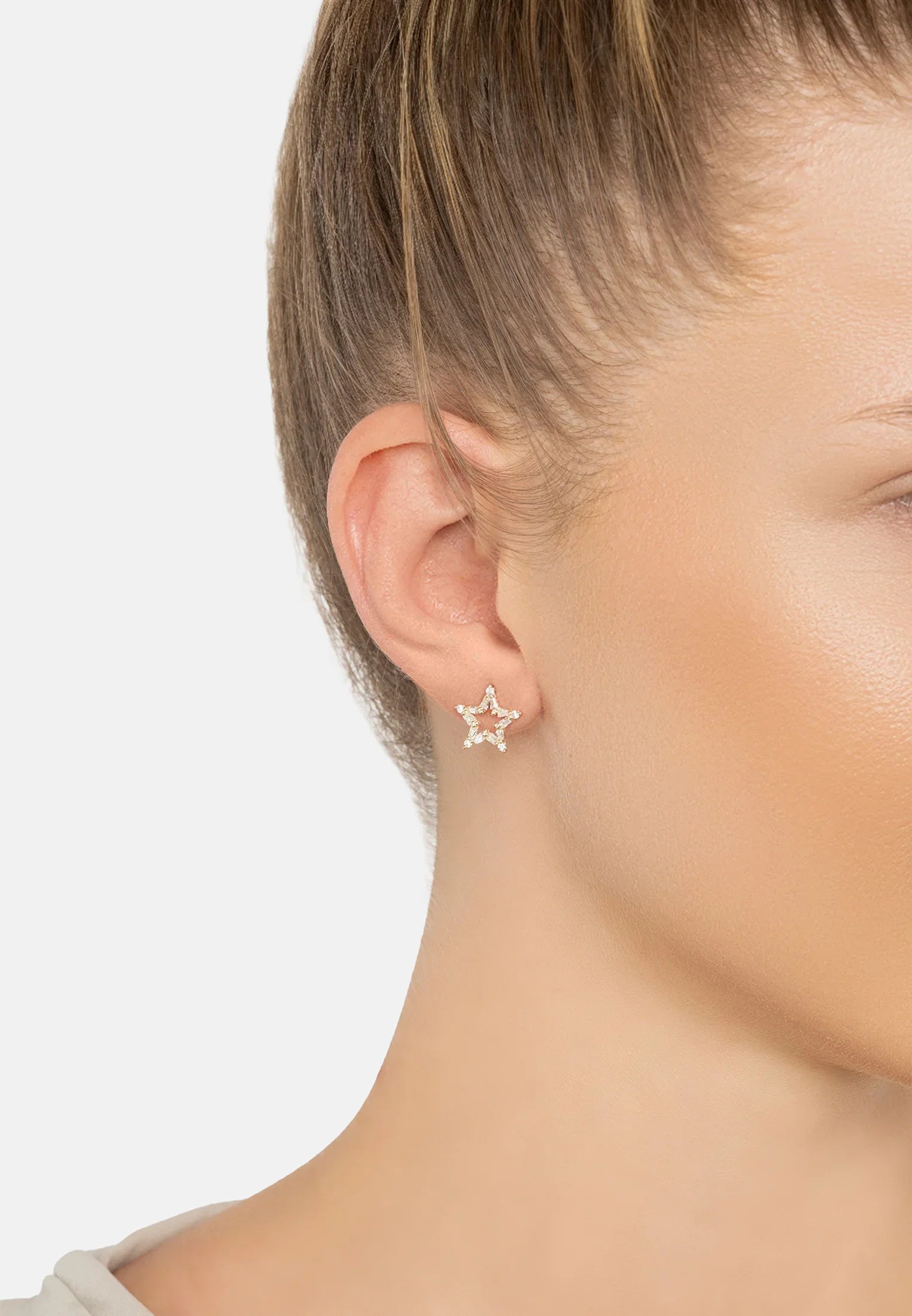 The earring worn by a model.