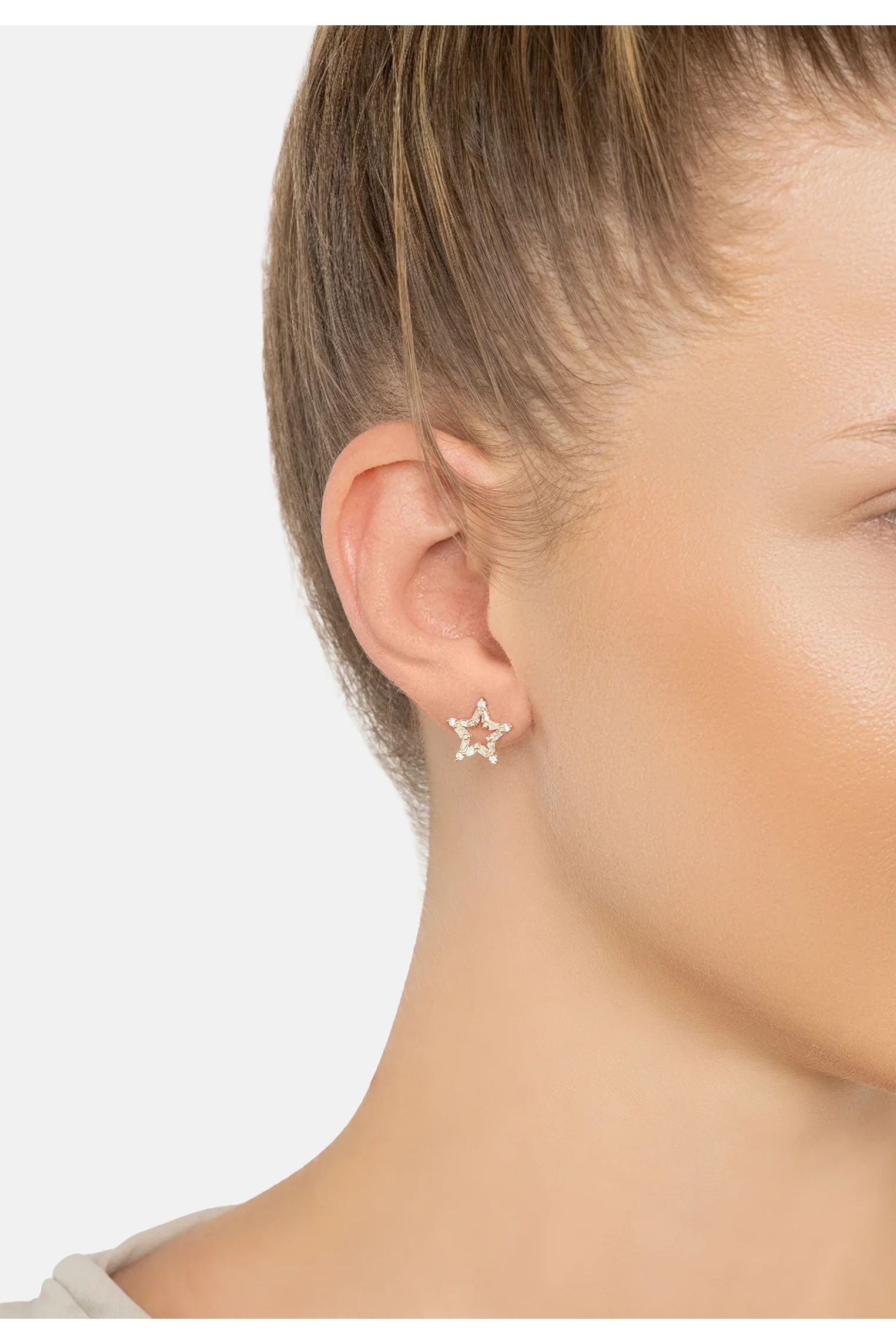 The earring worn by a model.