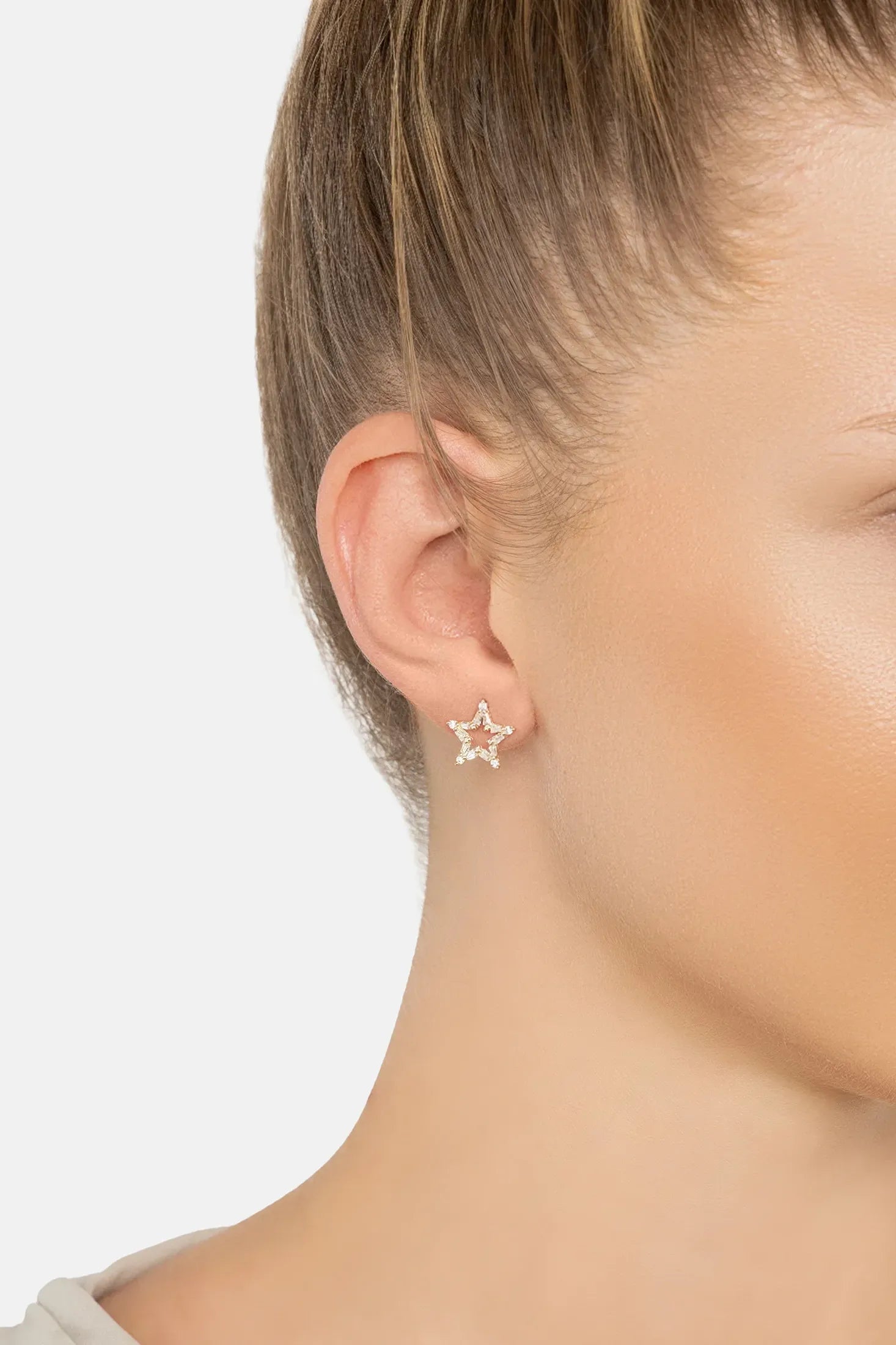 The earring worn by a model.