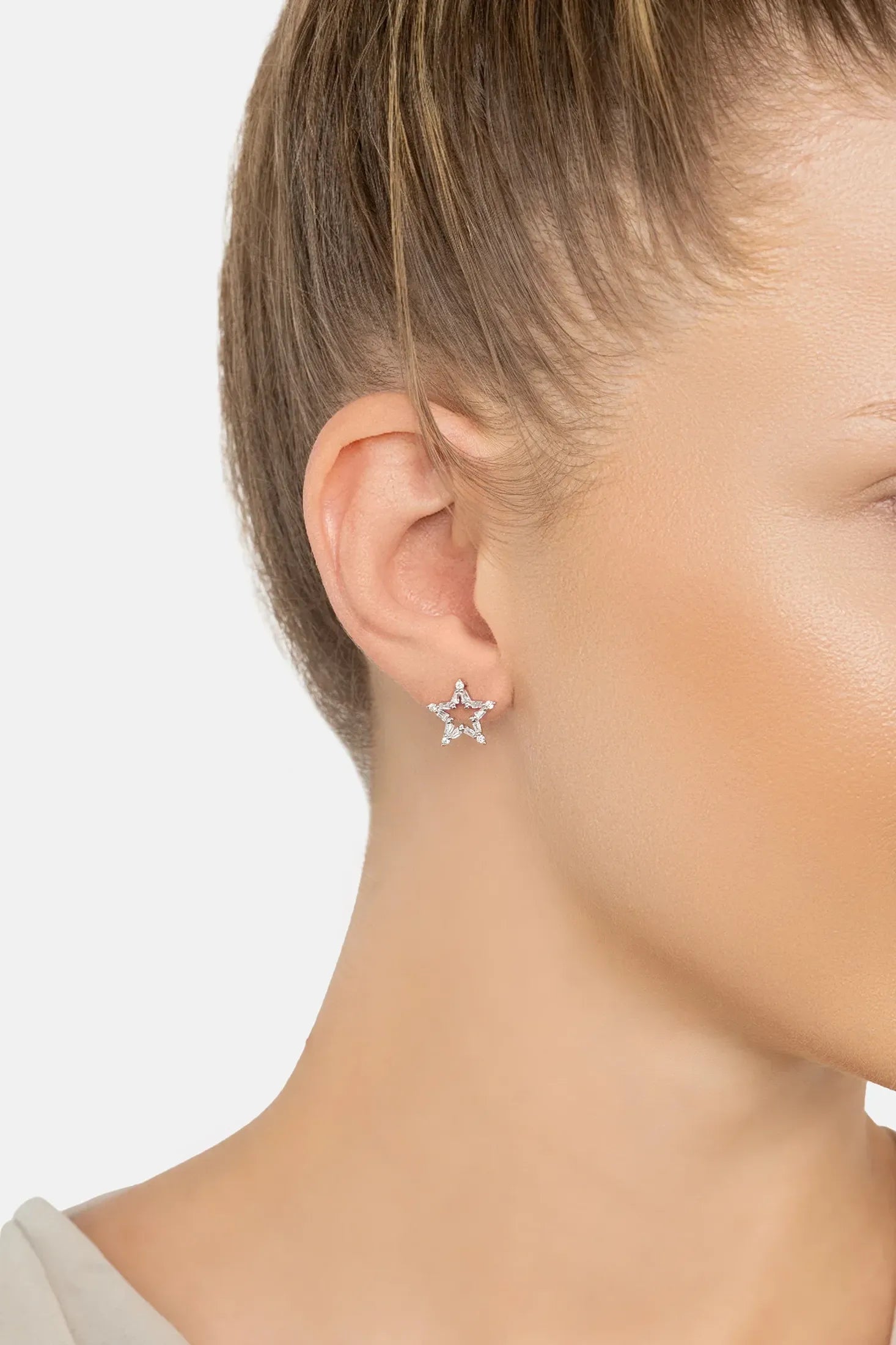 The earring worn by a model.