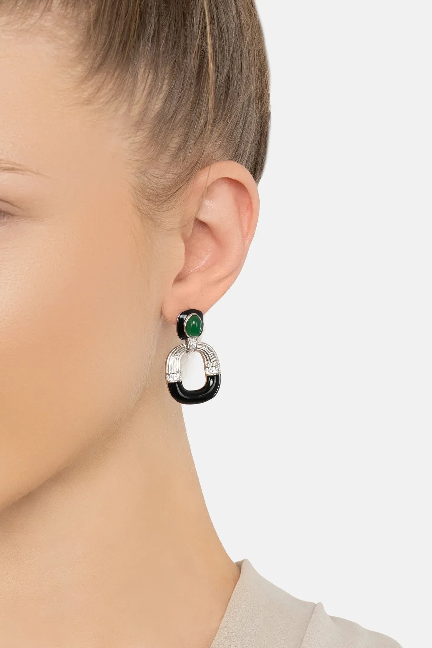 The earring worn by a model.
