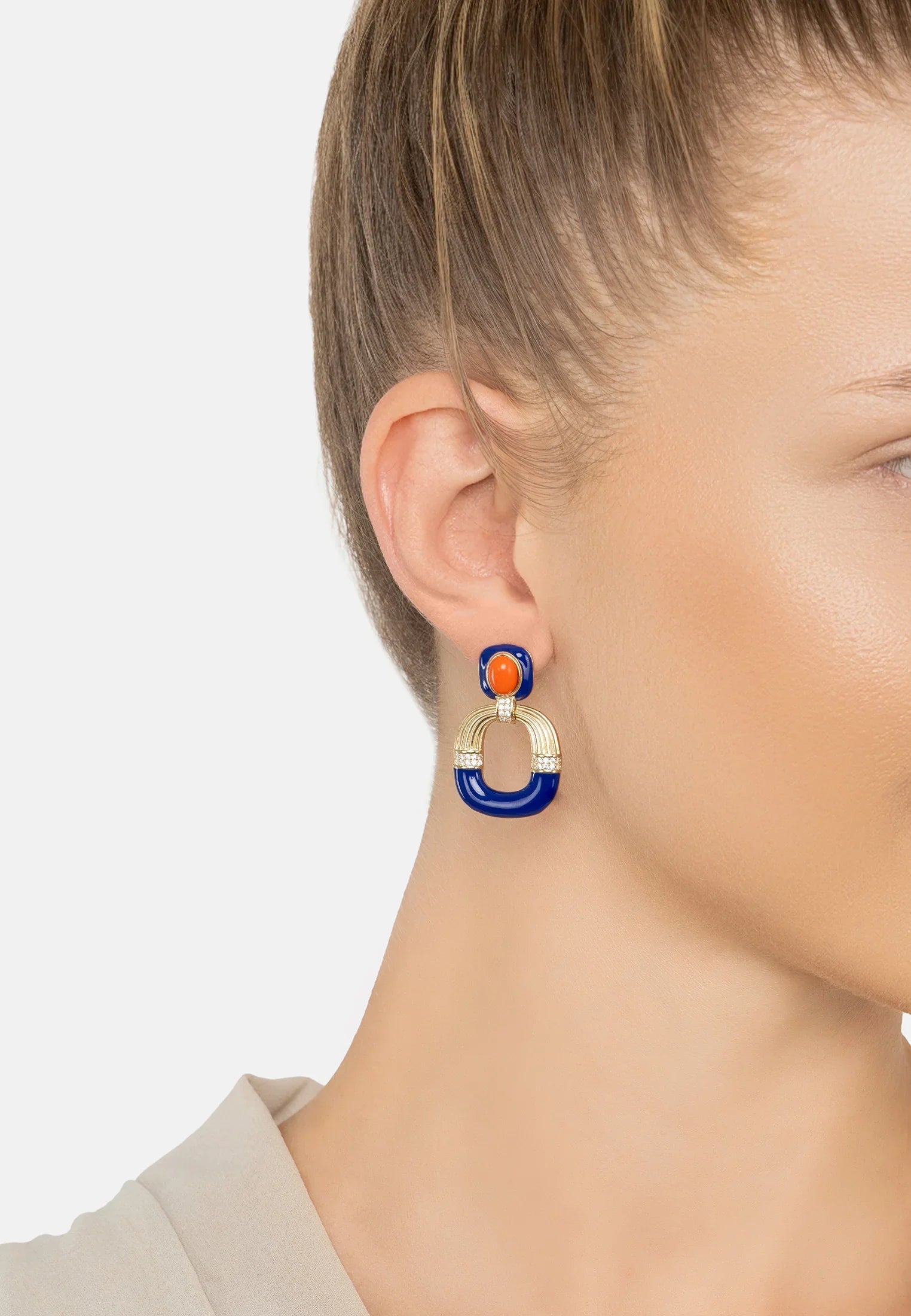 The earring worn by a model.