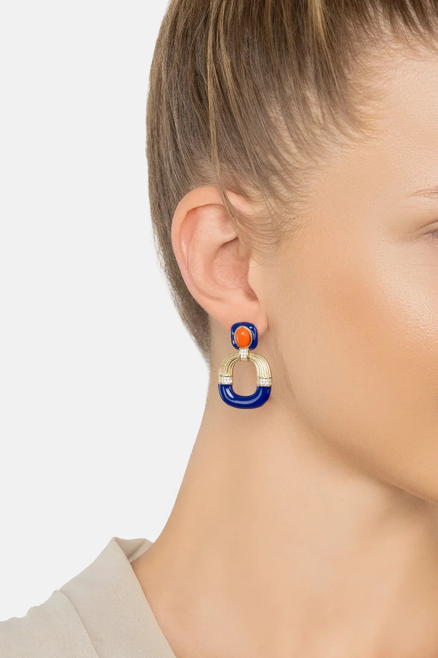 The earring worn by a model.