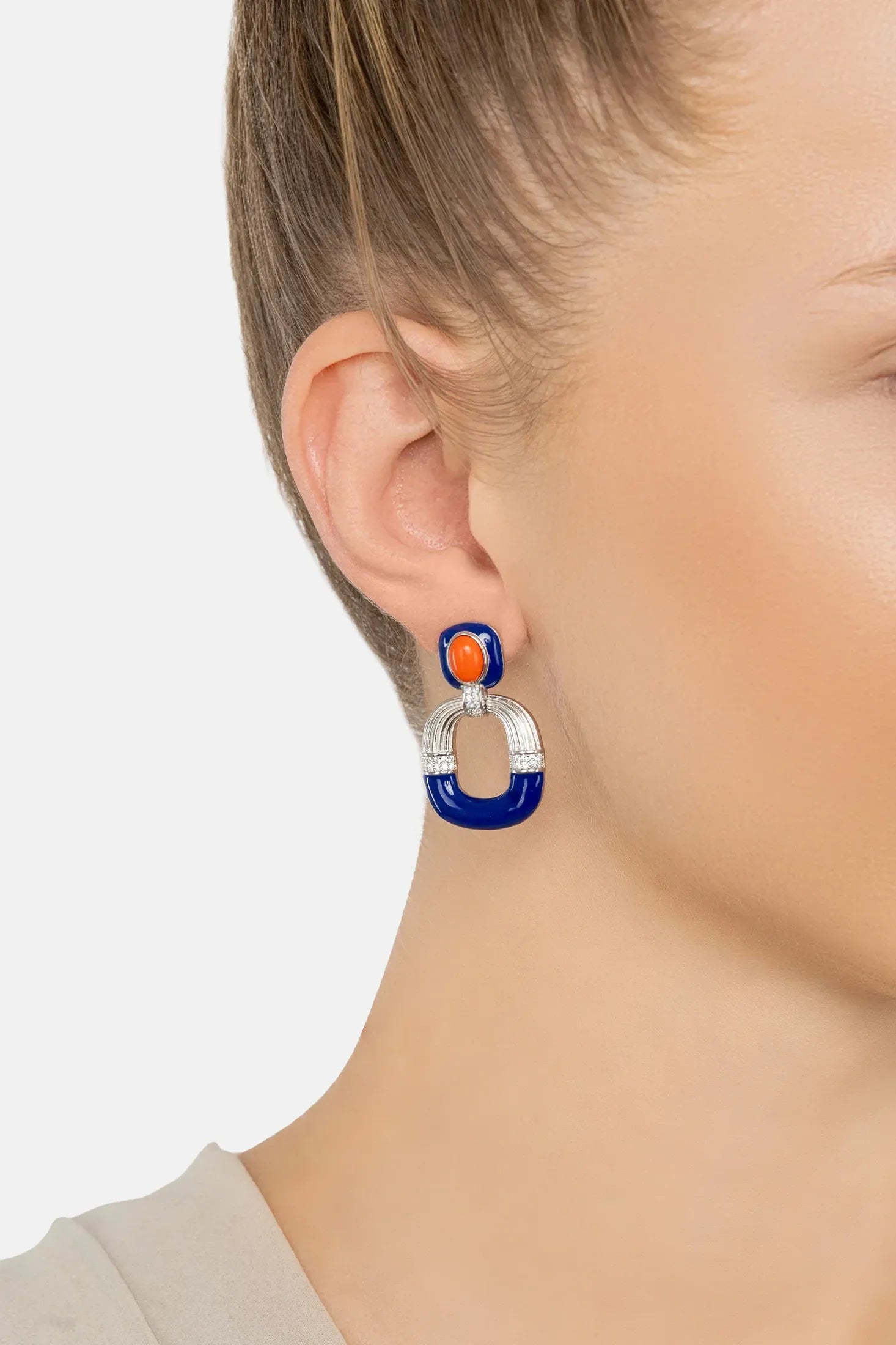 The earring worn by a model.