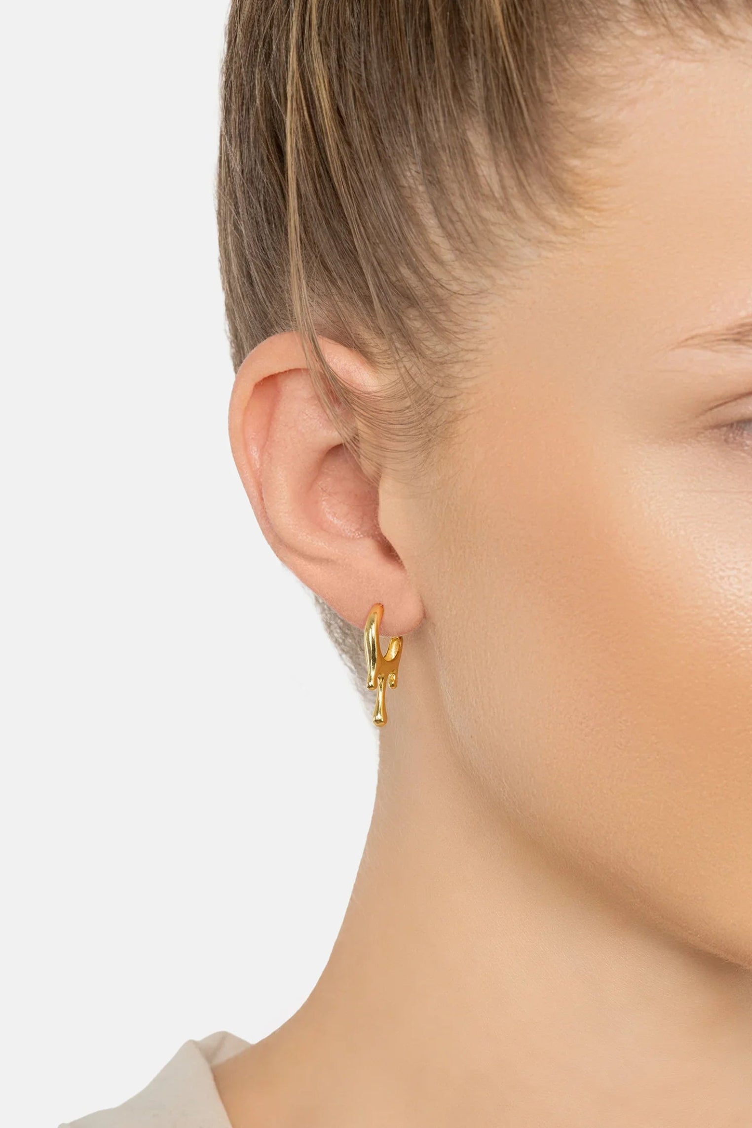 The earring worn by a model.