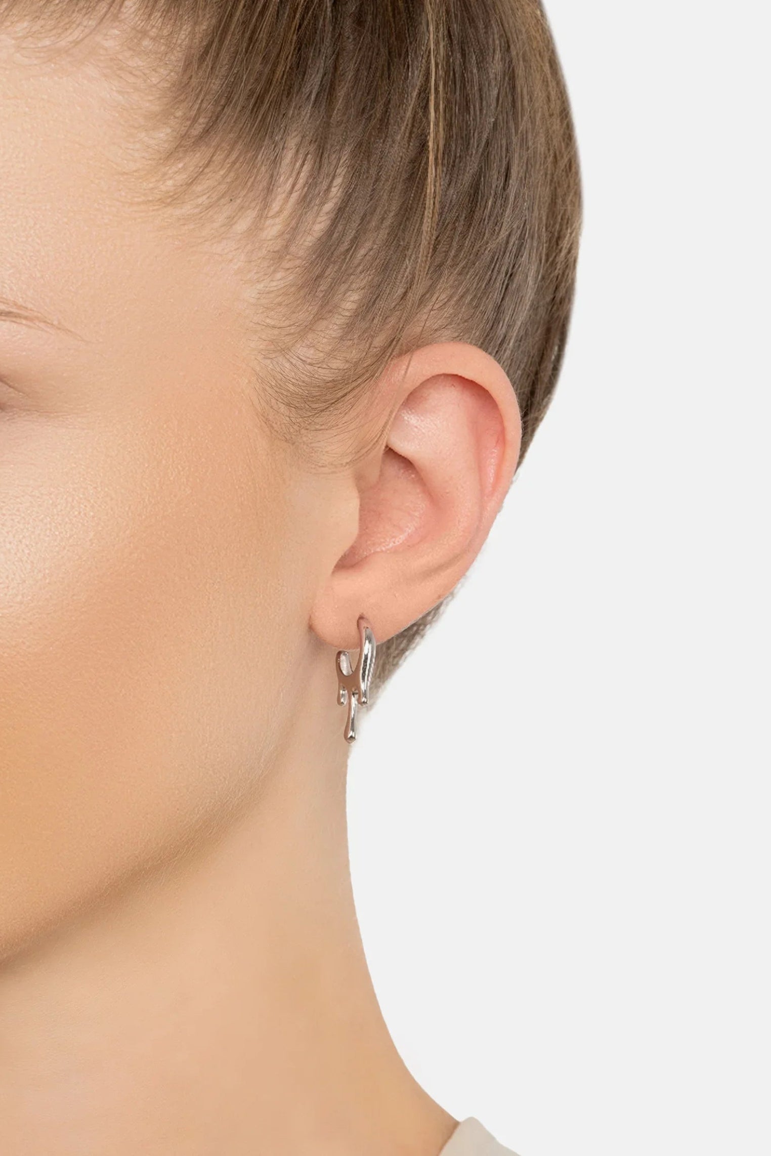 The earring worn by a model.