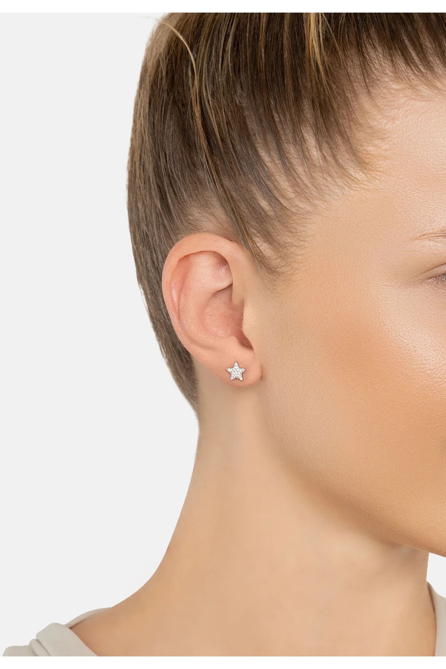 The earring worn by a model.