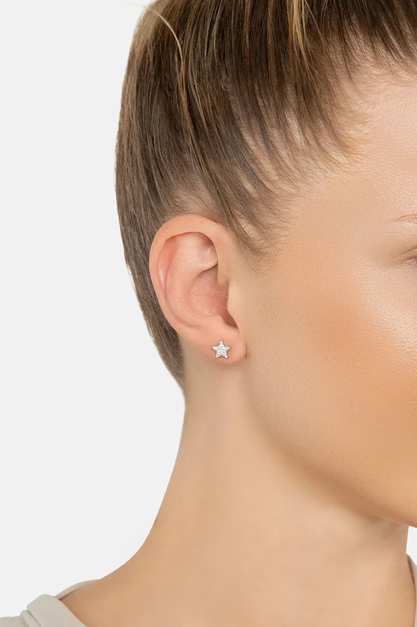 The earring worn by a model.
