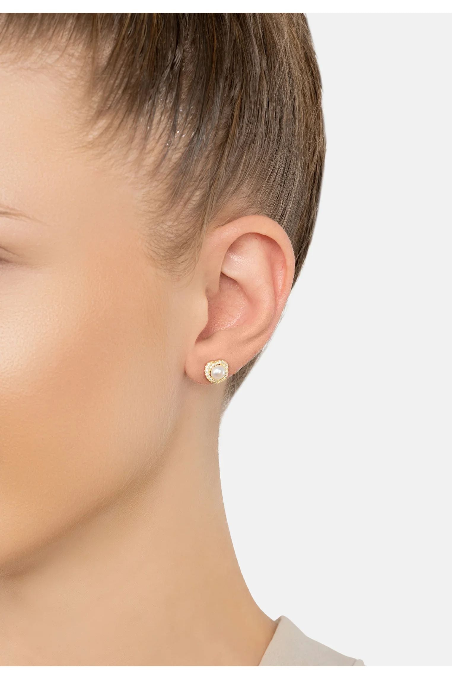 The earring worn by a model.