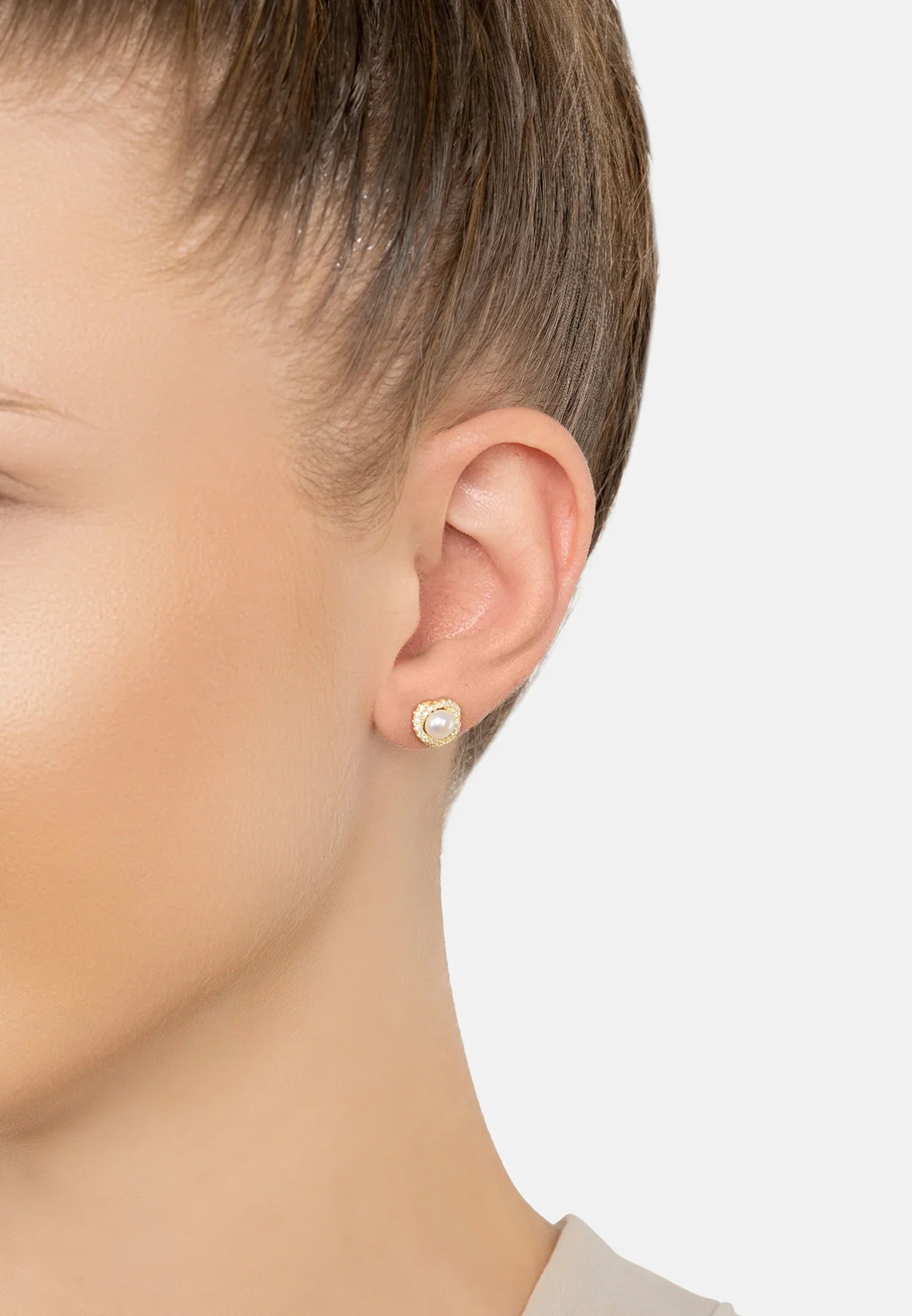The earring worn by a model.