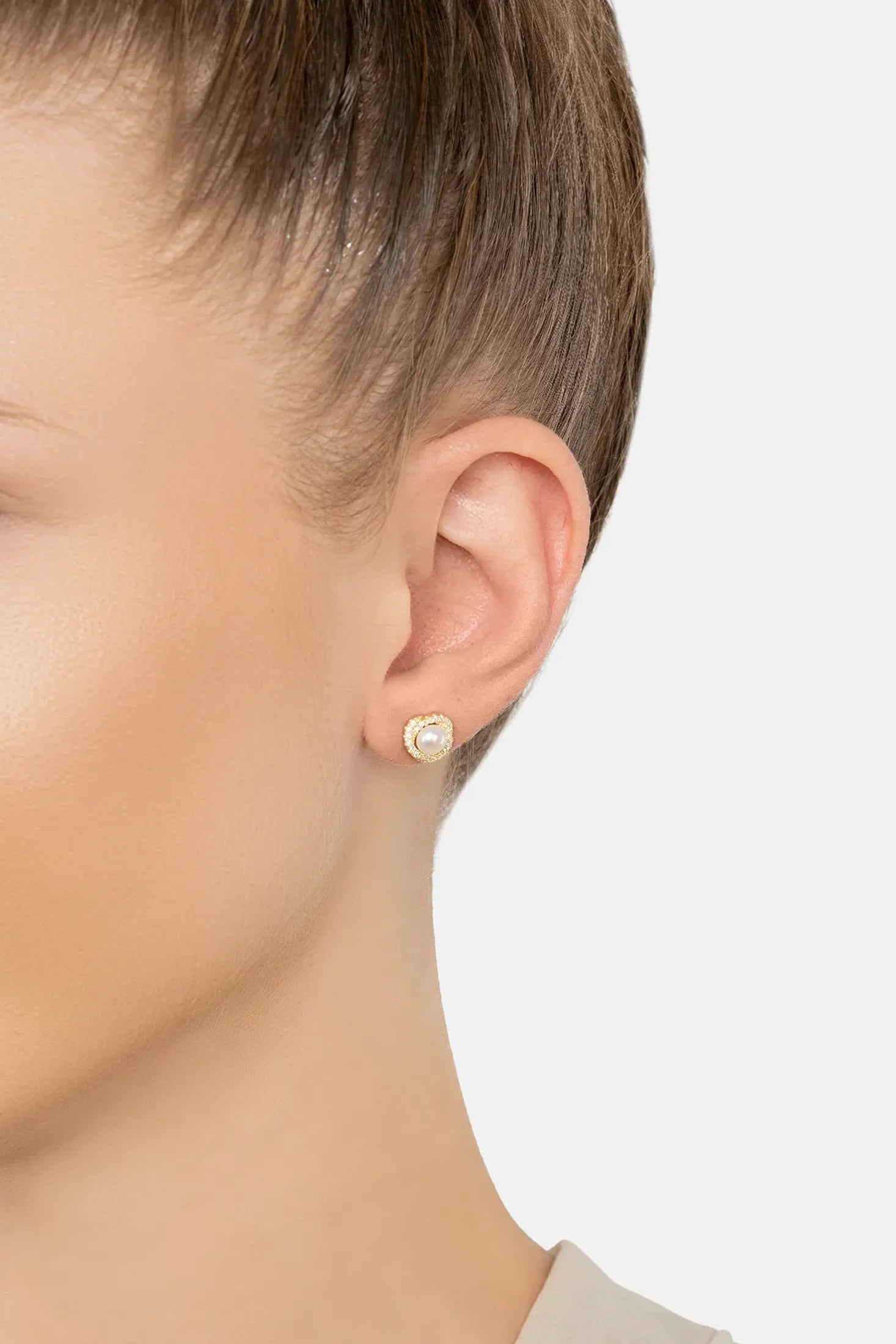 The earring worn by a model.