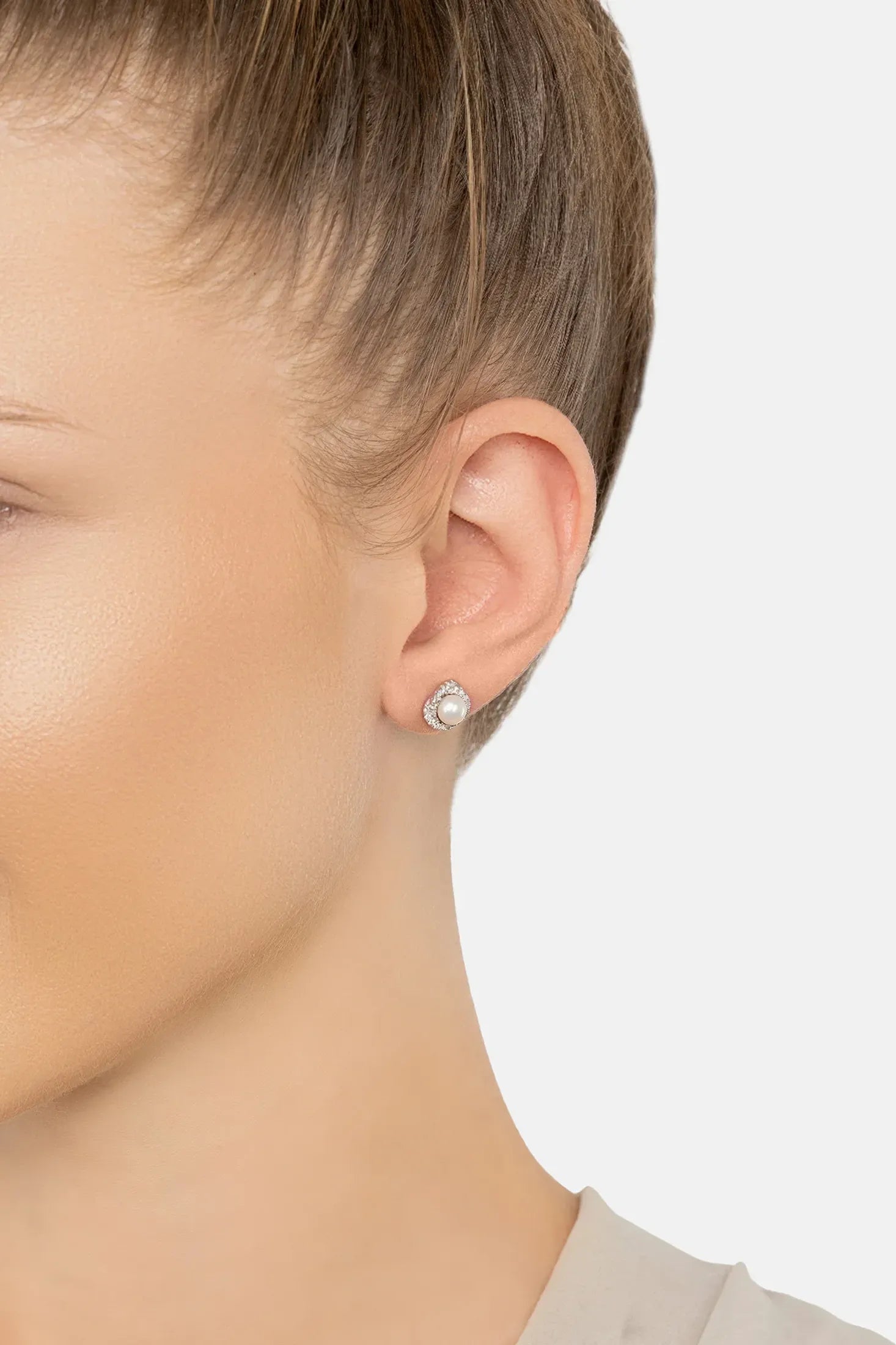 The earring worn by a model.