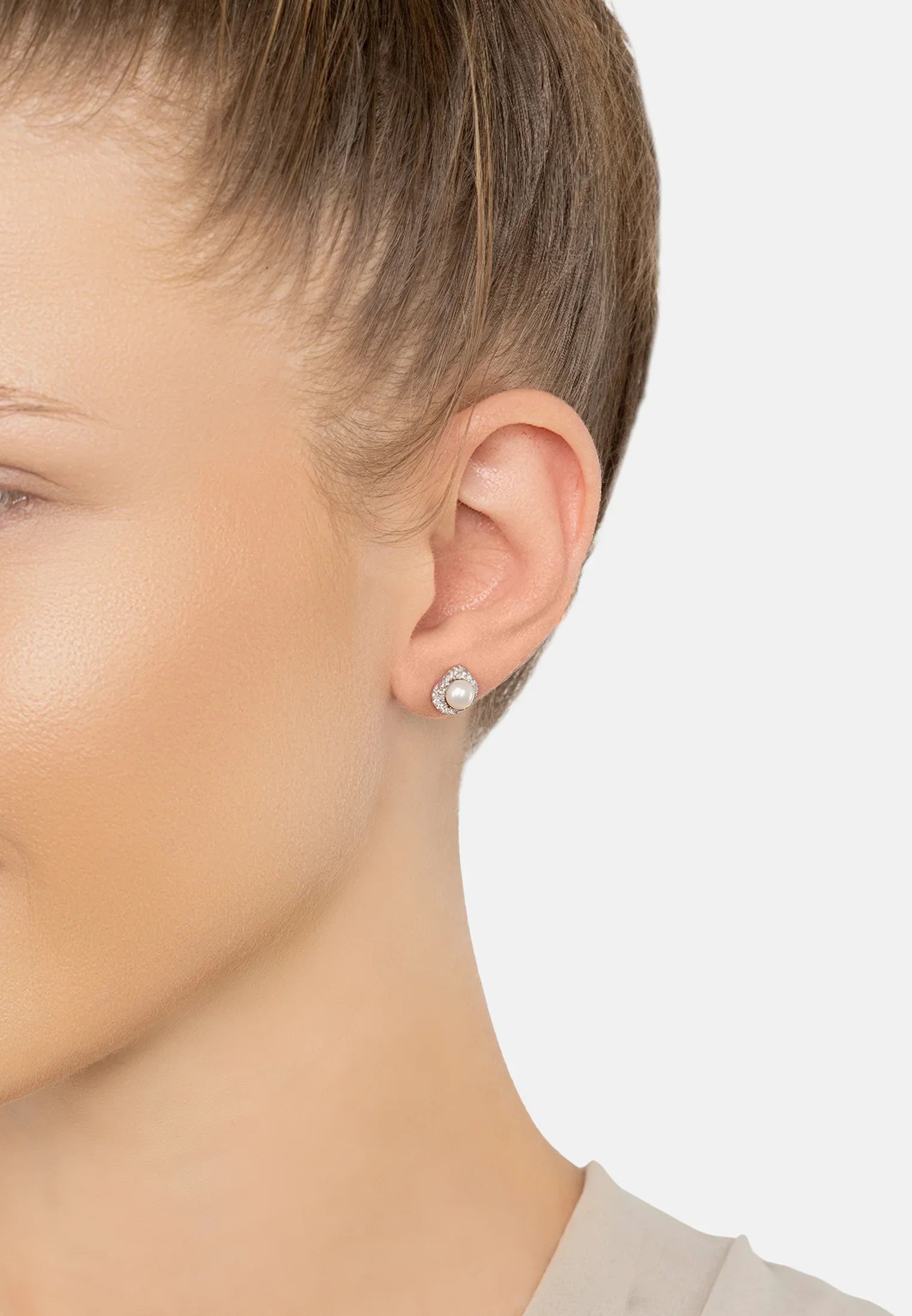 The earring worn by a model.