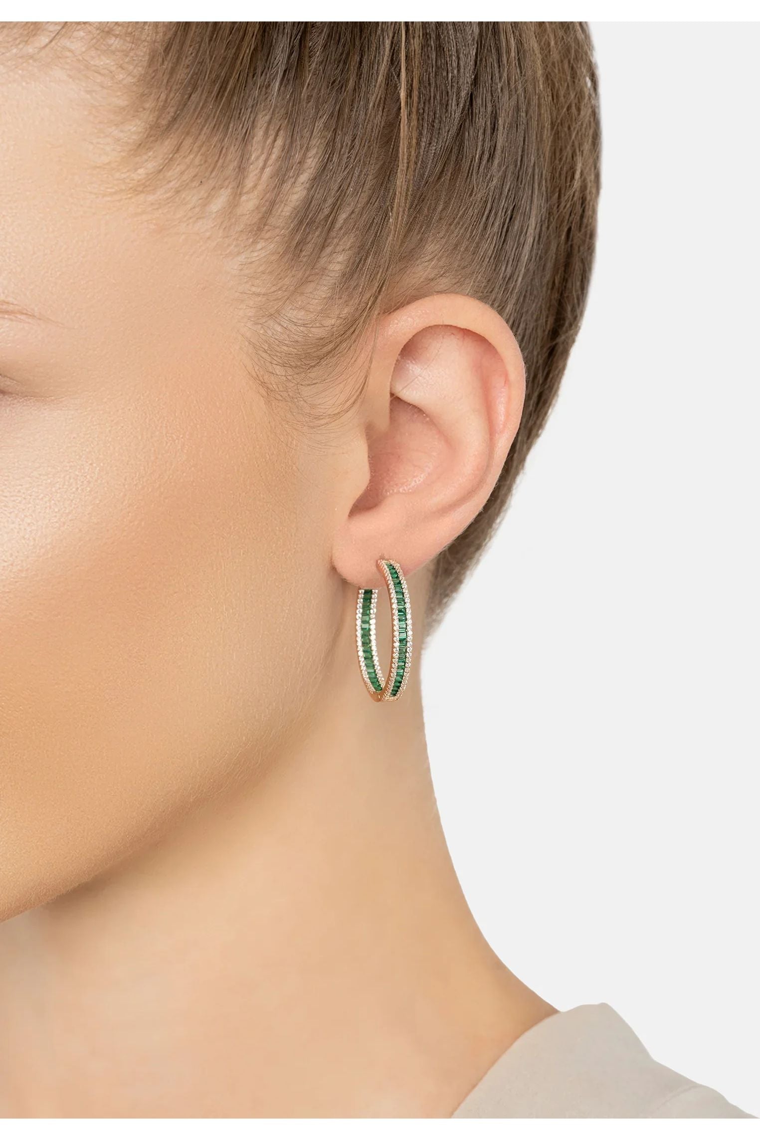 The earring worn by a model.