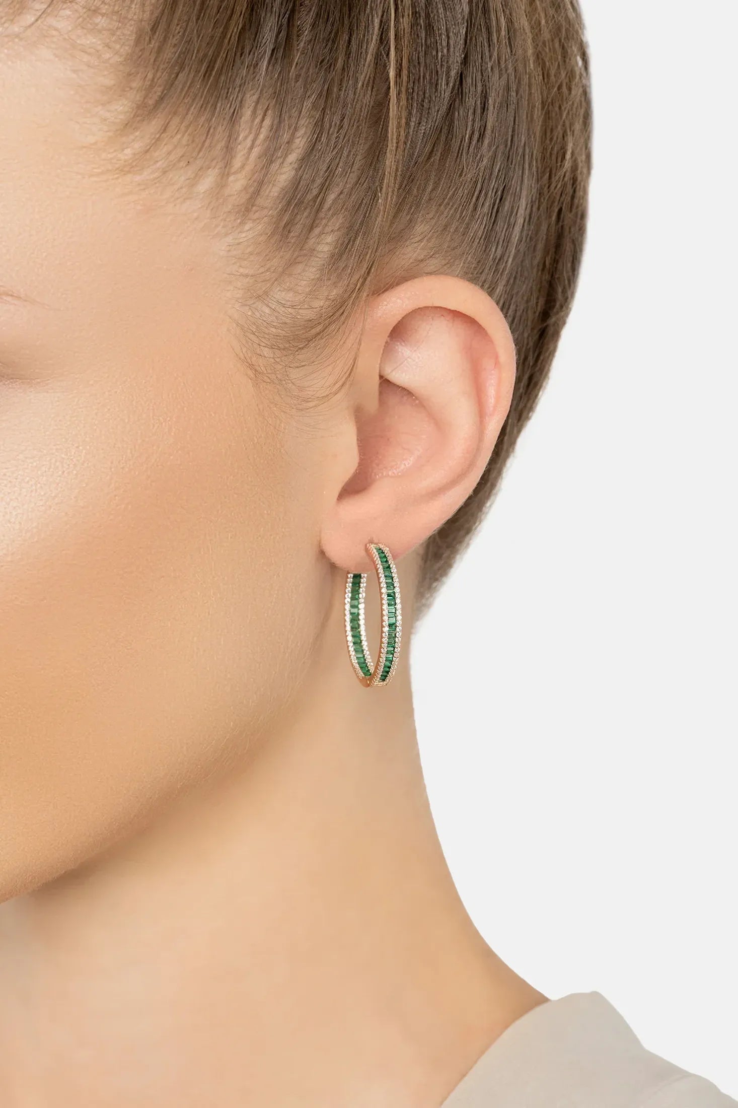 The earring worn by a model.