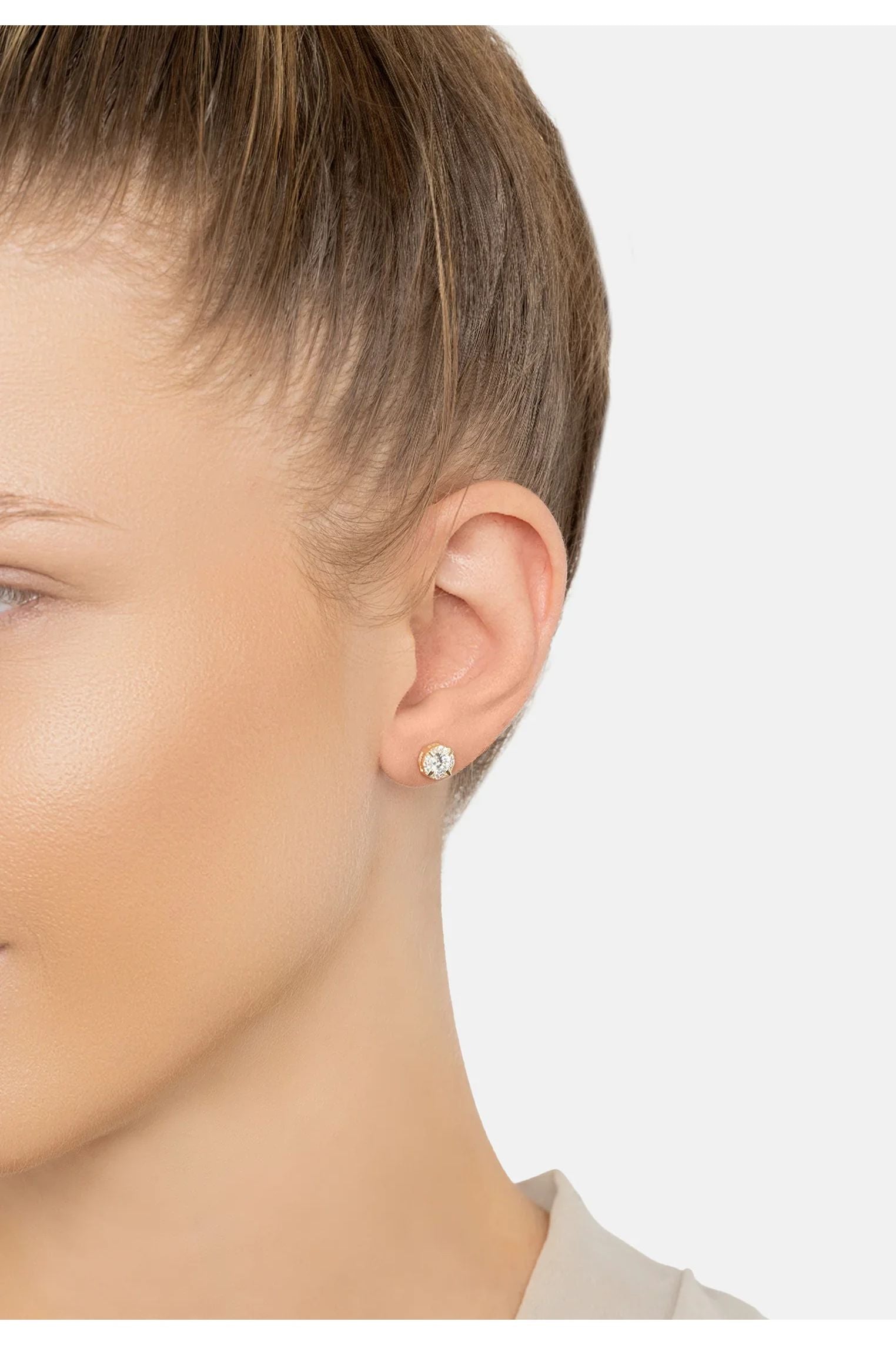 The earring worn by a model.