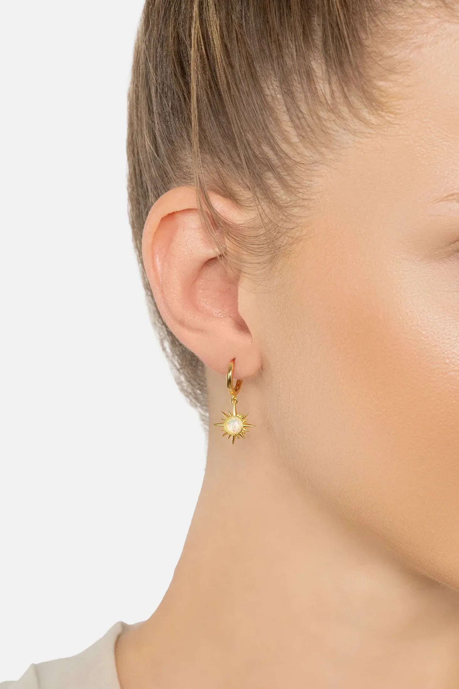 The earring worn by a model.