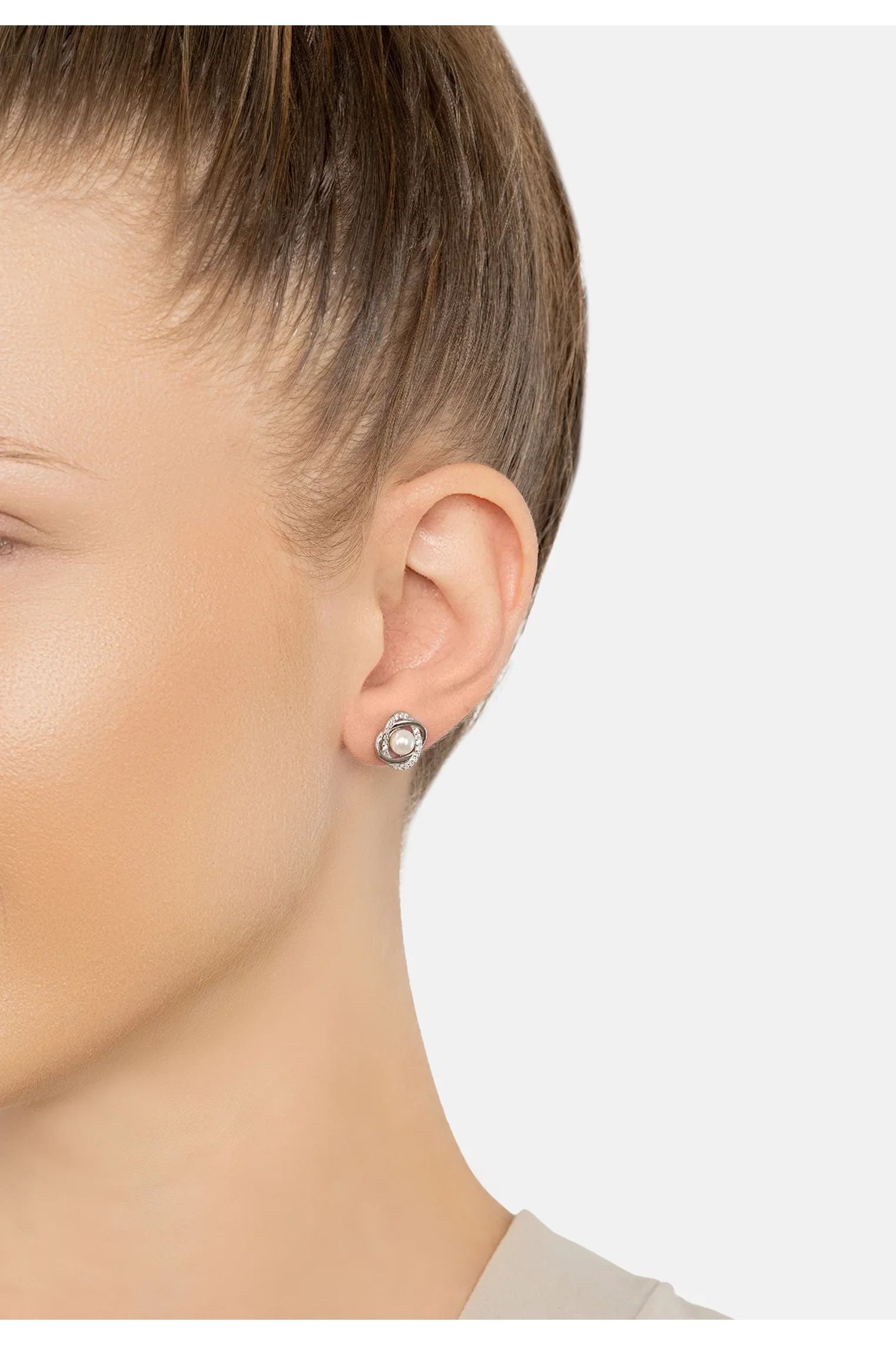 The earring worn by a model.