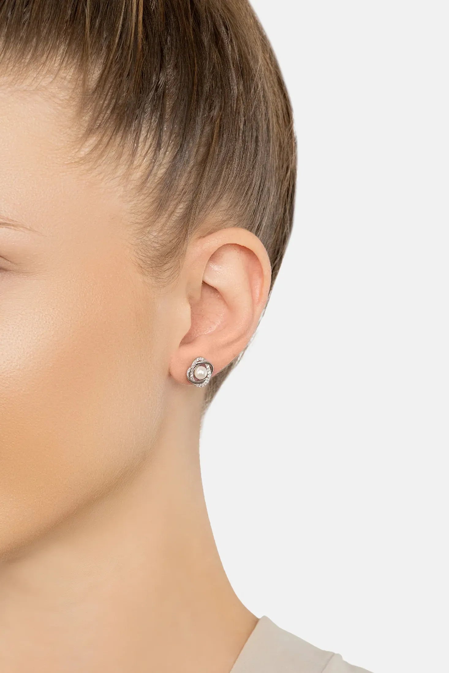 The earring worn by a model.