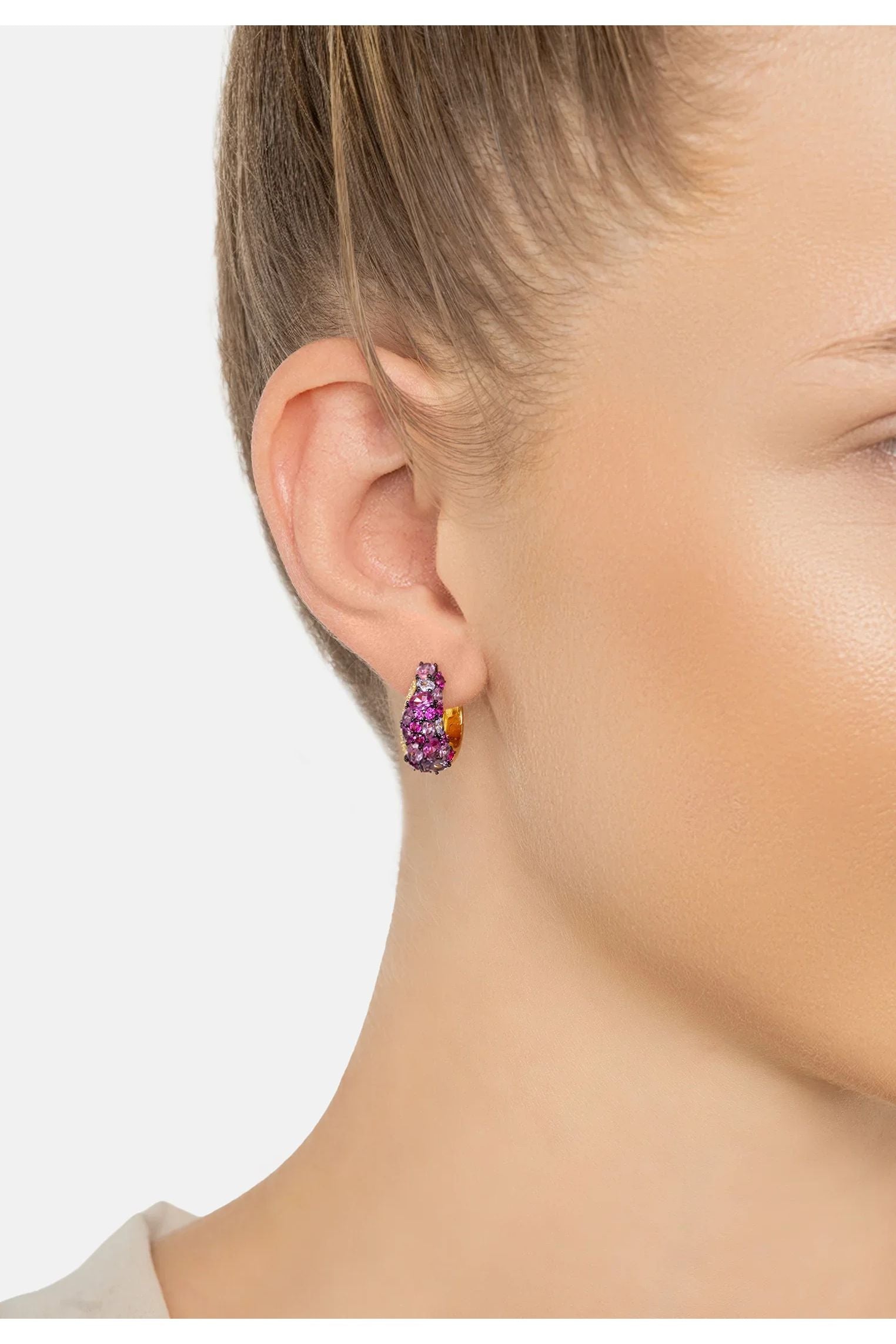 The earring worn by a model.