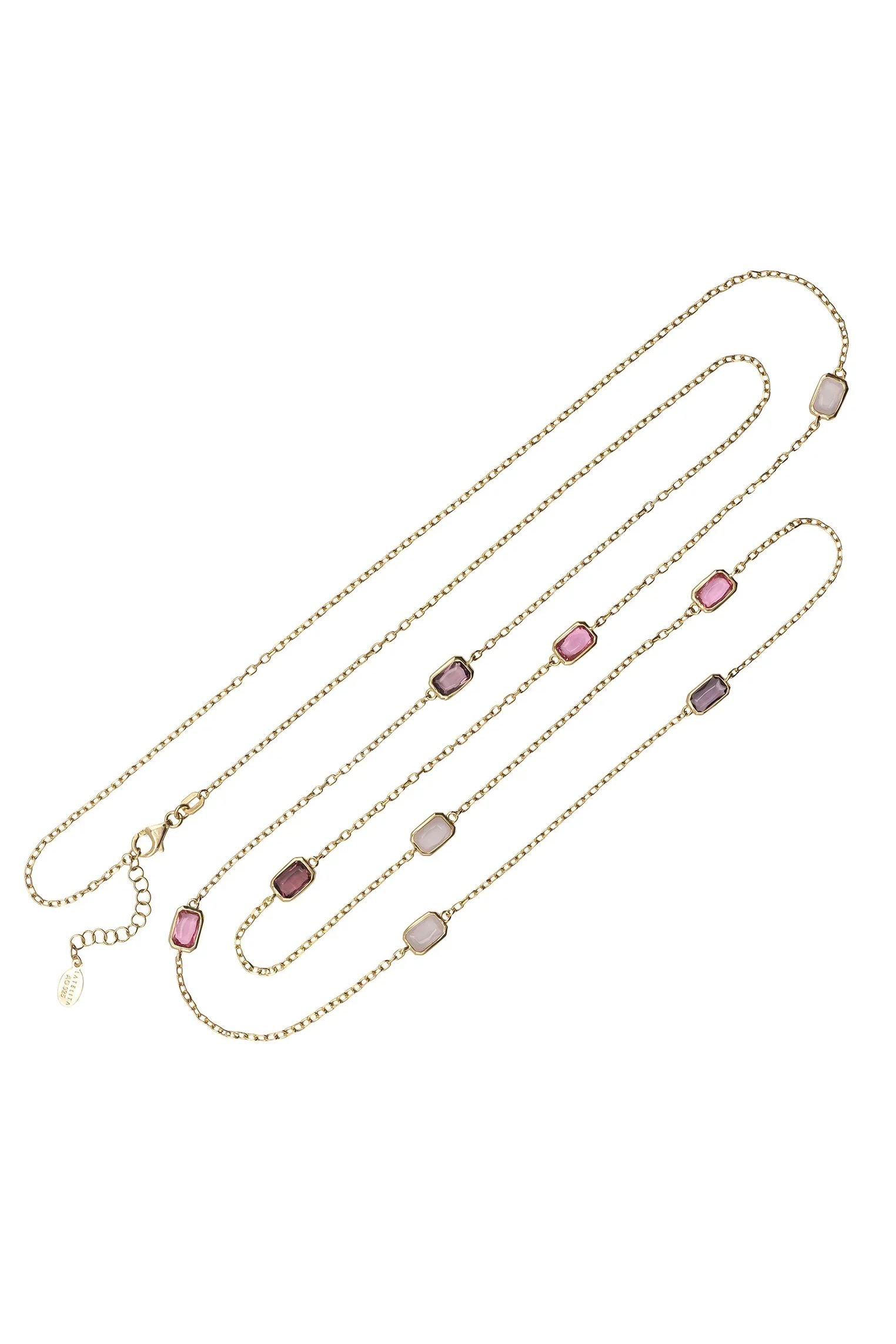 Multiple pink gemstone long gold necklace.
