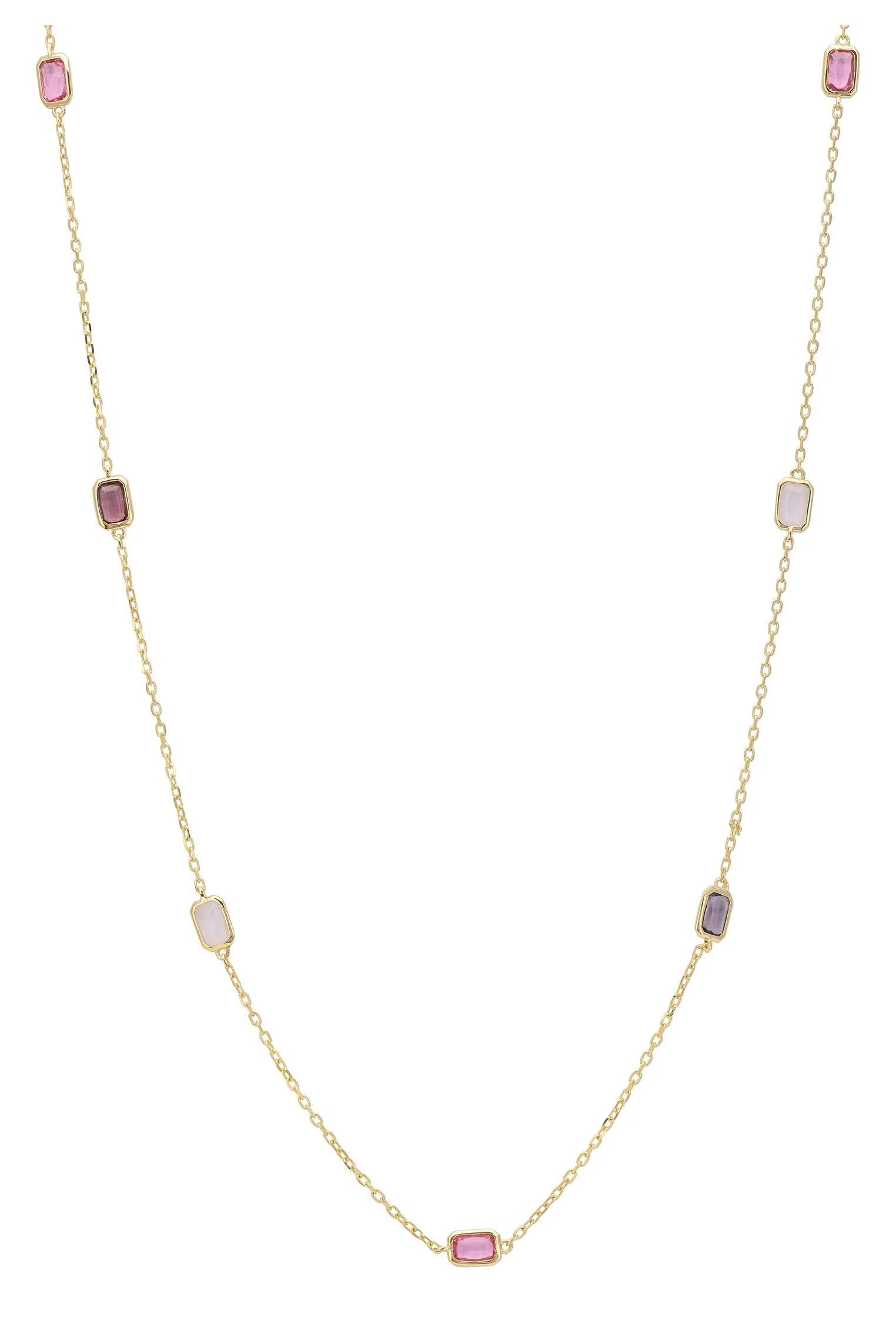 Multiple pink gemstone long gold necklace.