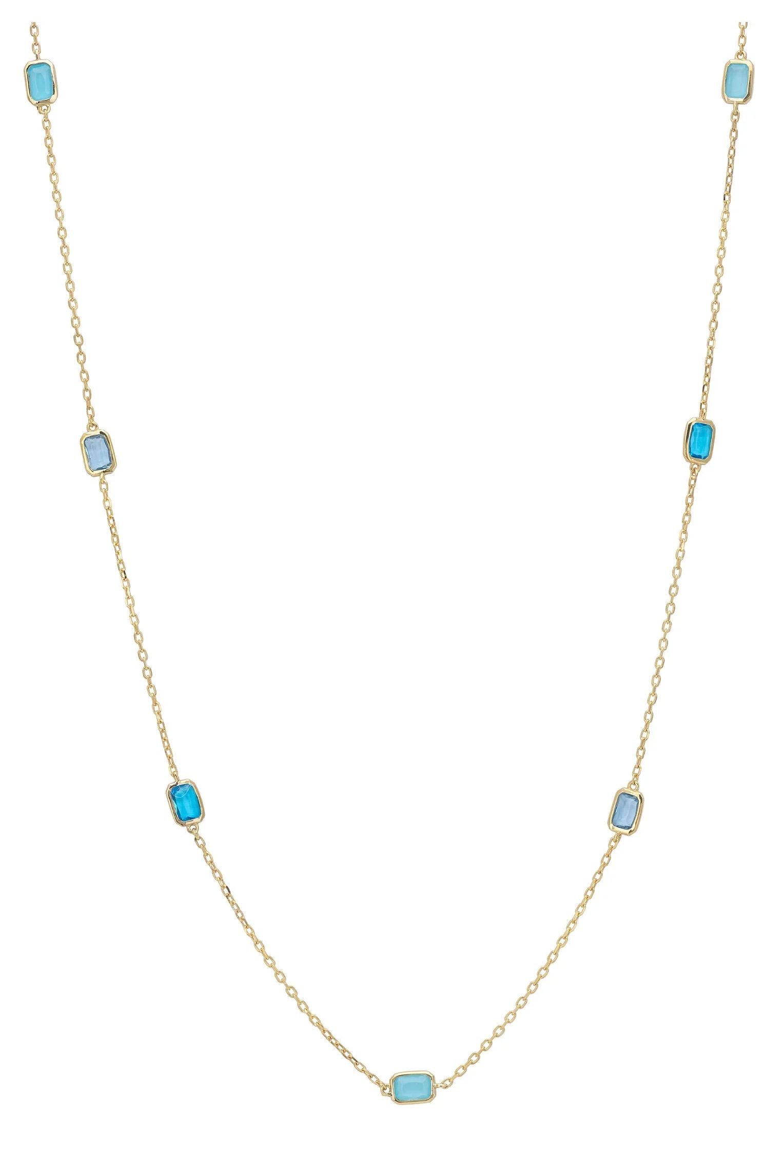 Multiple blue gemstone long gold necklace.