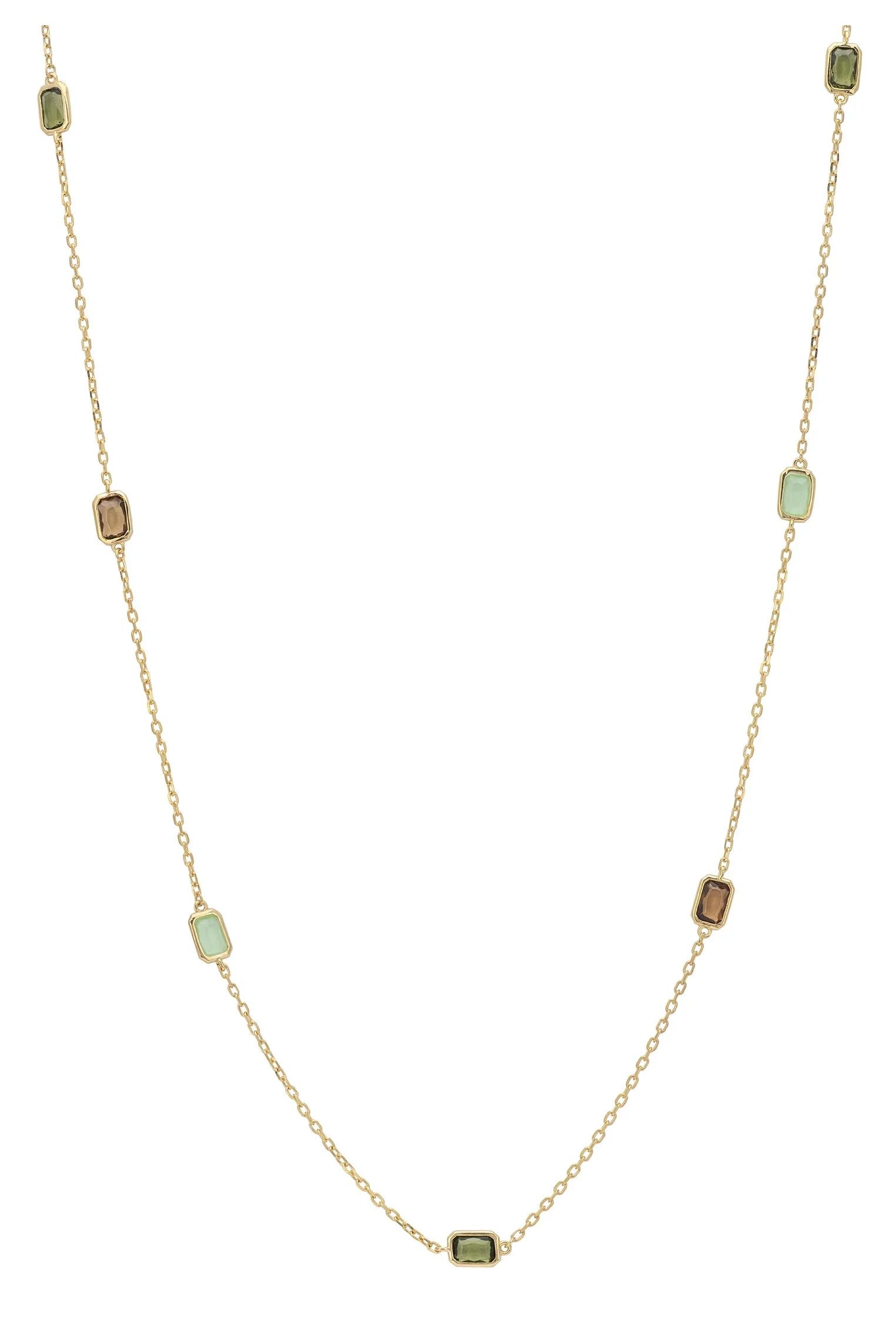 Multiple green gemstone long gold necklace.