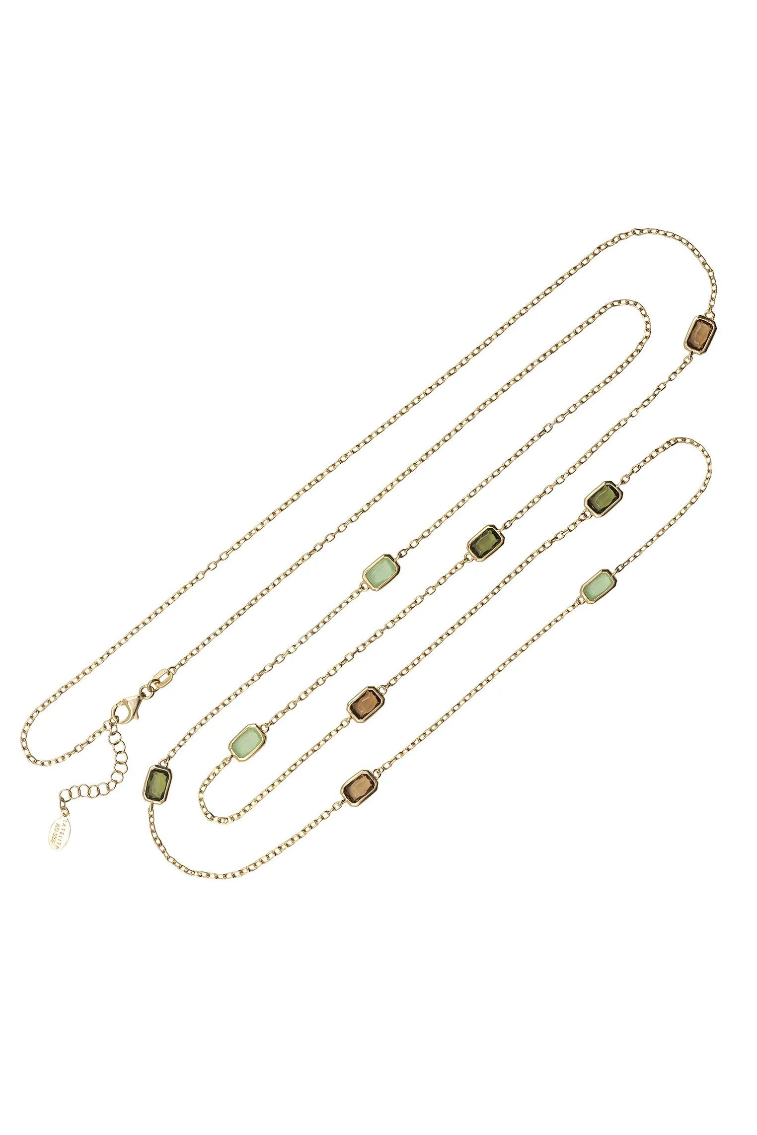Multiple green gemstone long gold necklace.