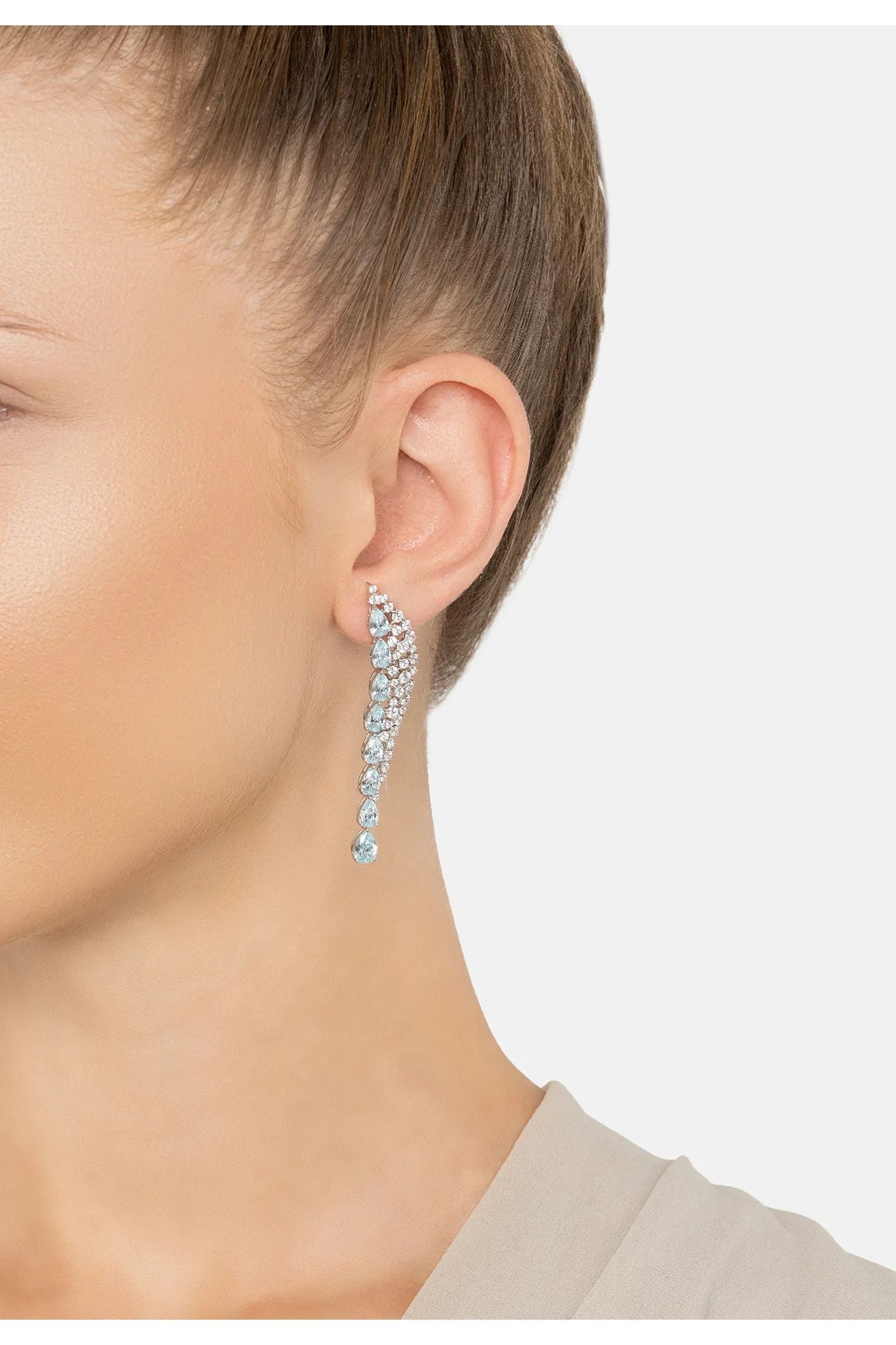 The earring worn by a model.