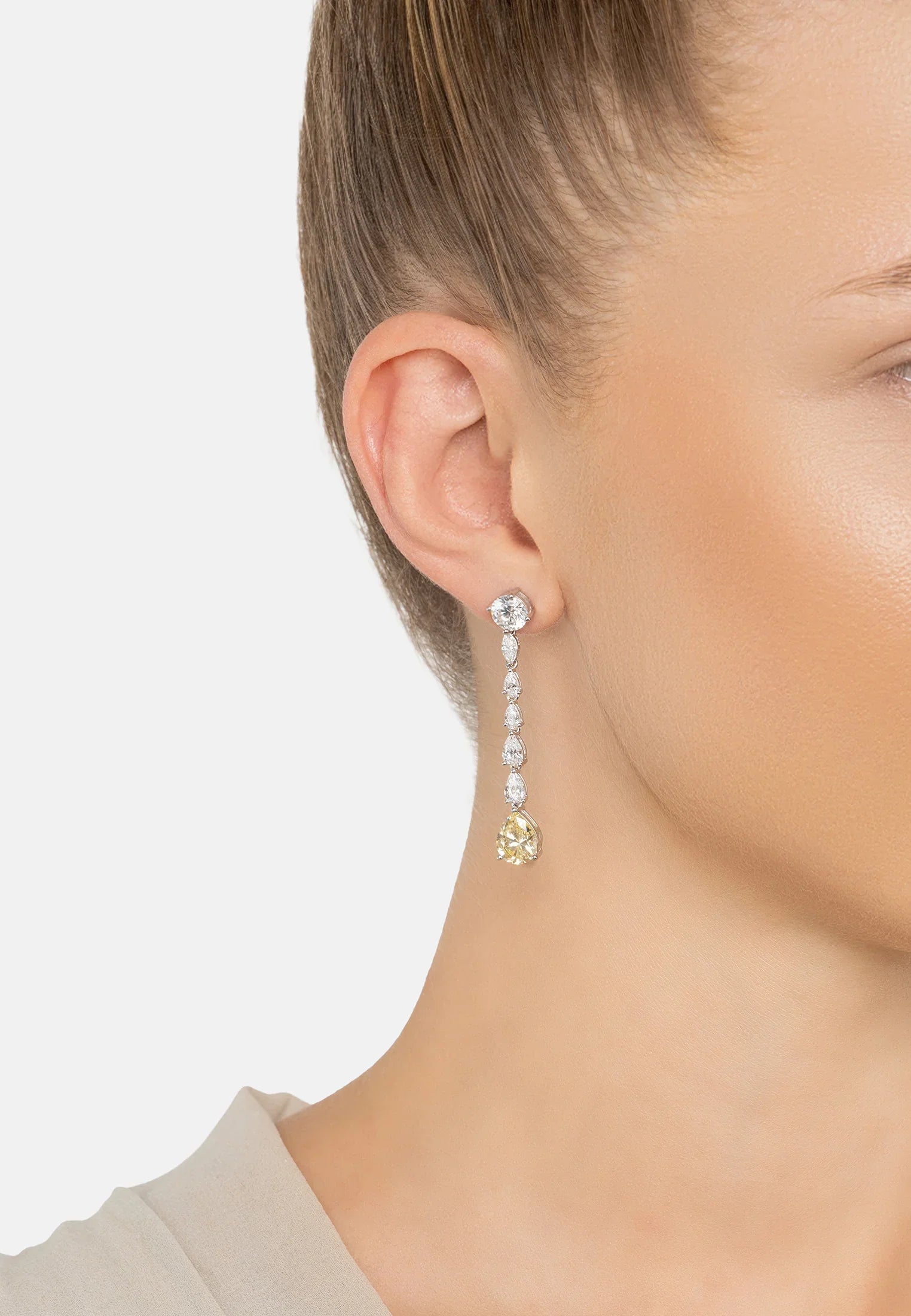 The earring worn by a model.