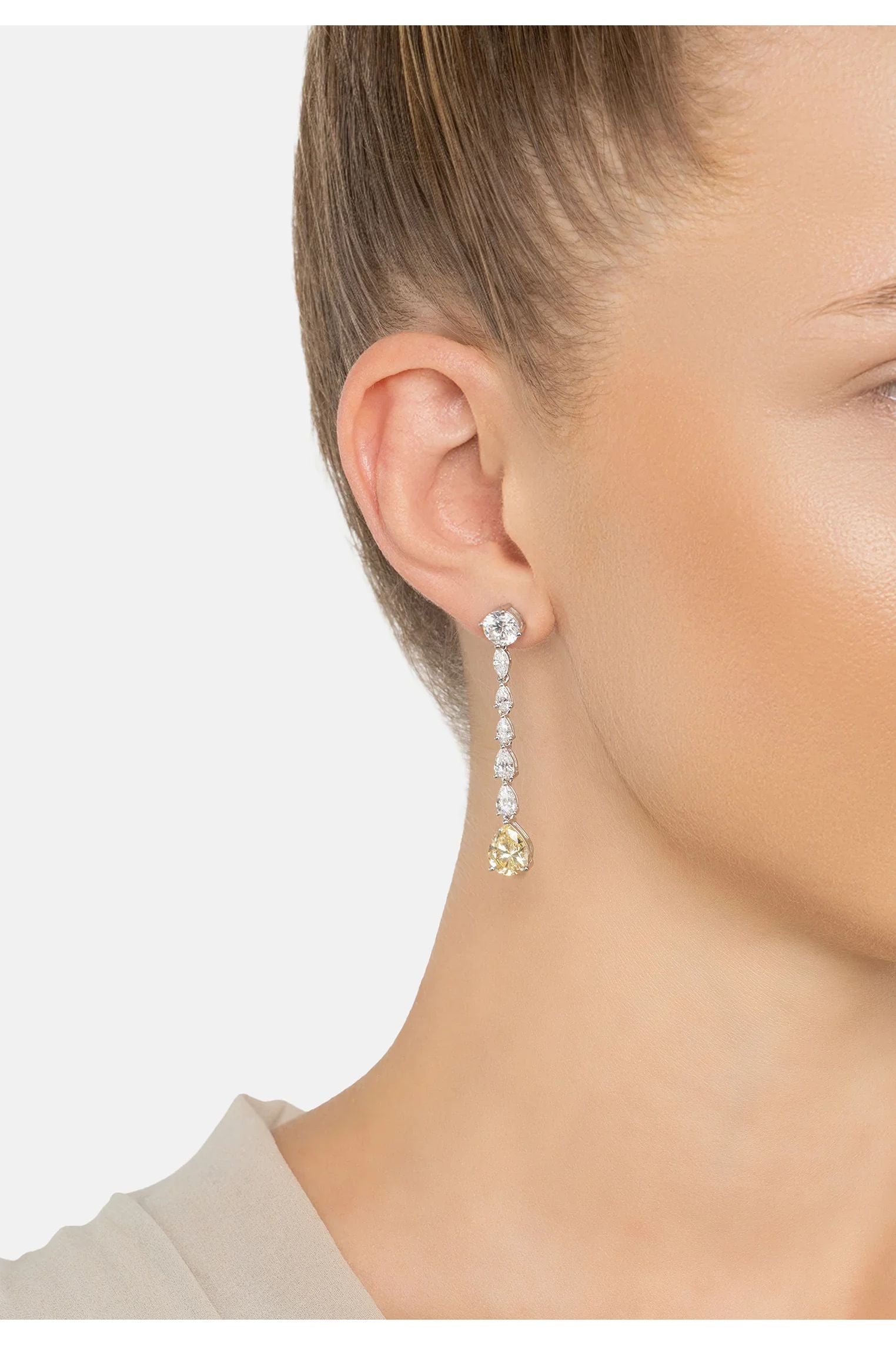 The earring worn by a model.