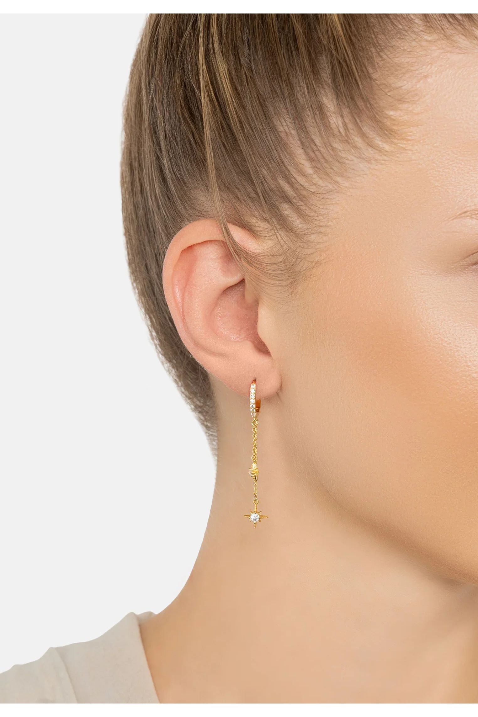 The earring worn by a model.