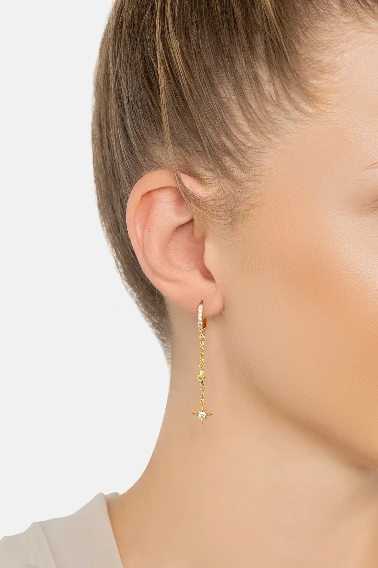 The earring worn by a model.