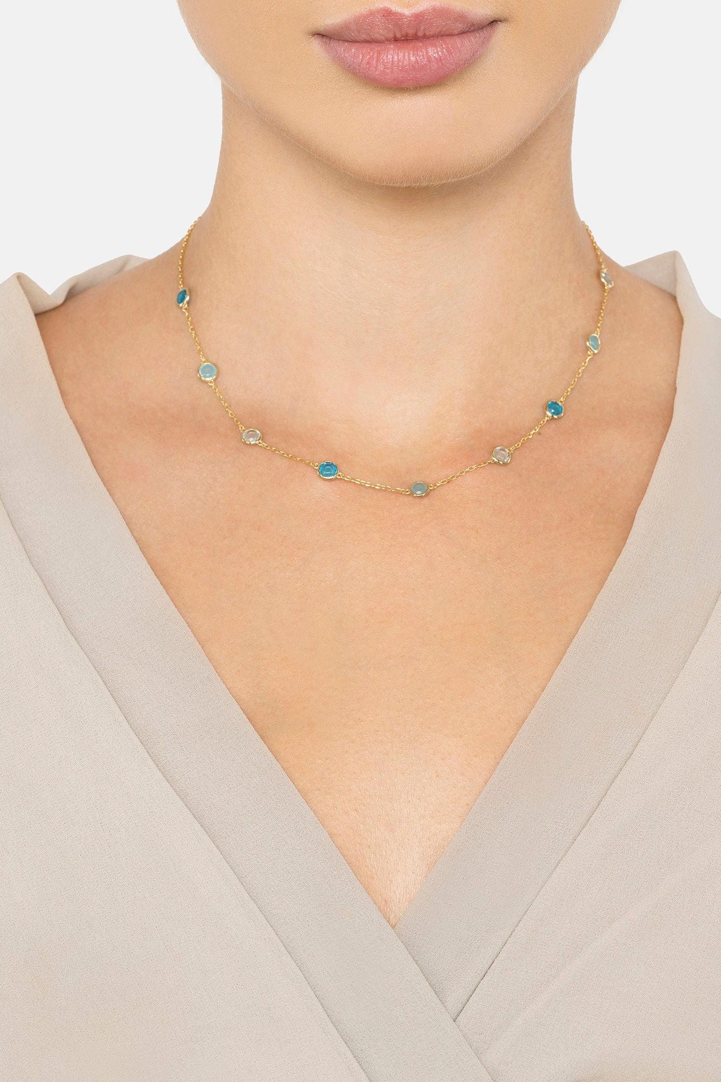 The necklace worn by a model.
