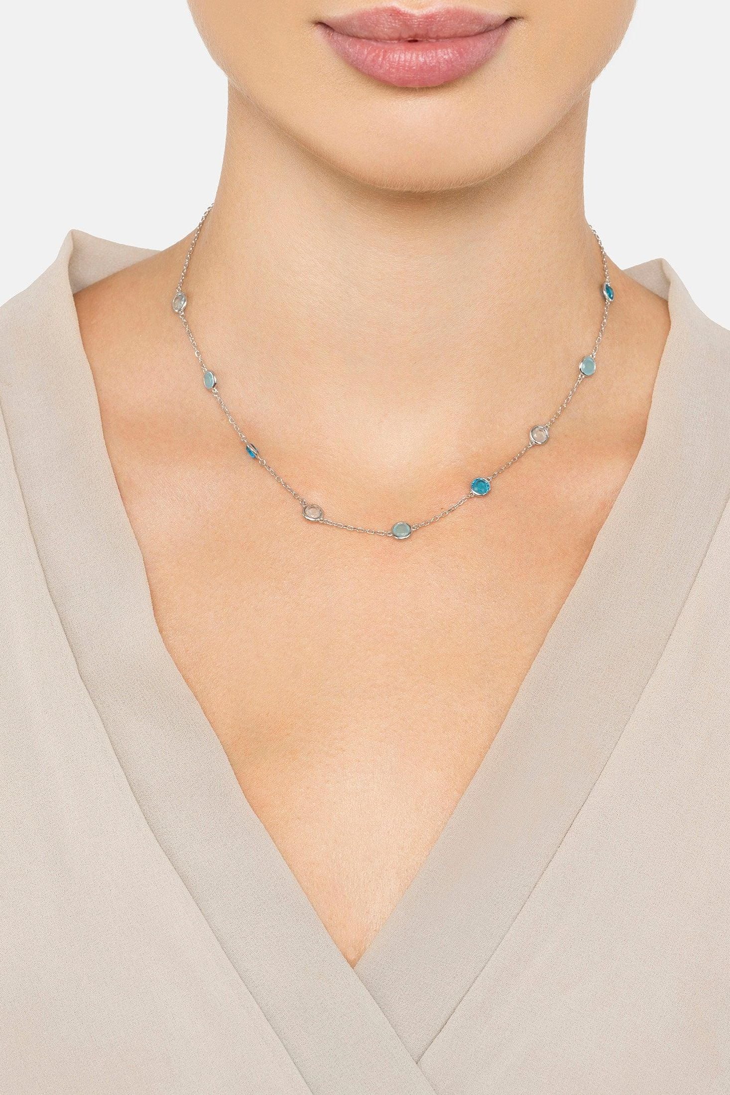 The necklace worn by a model.