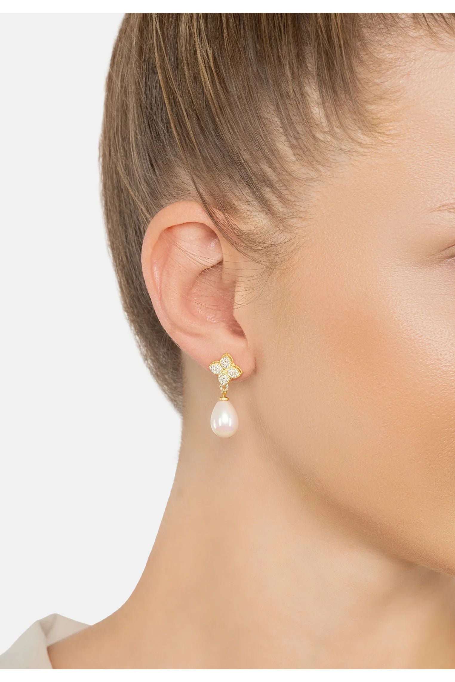 The earring worn by a model.