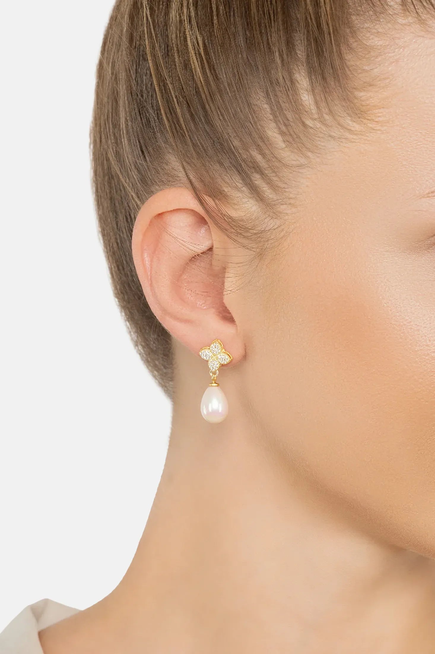 The earring worn by a model.
