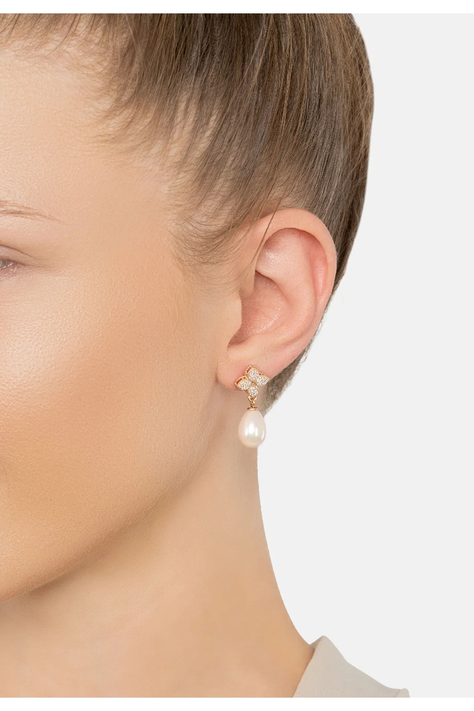 The earring worn by a model.