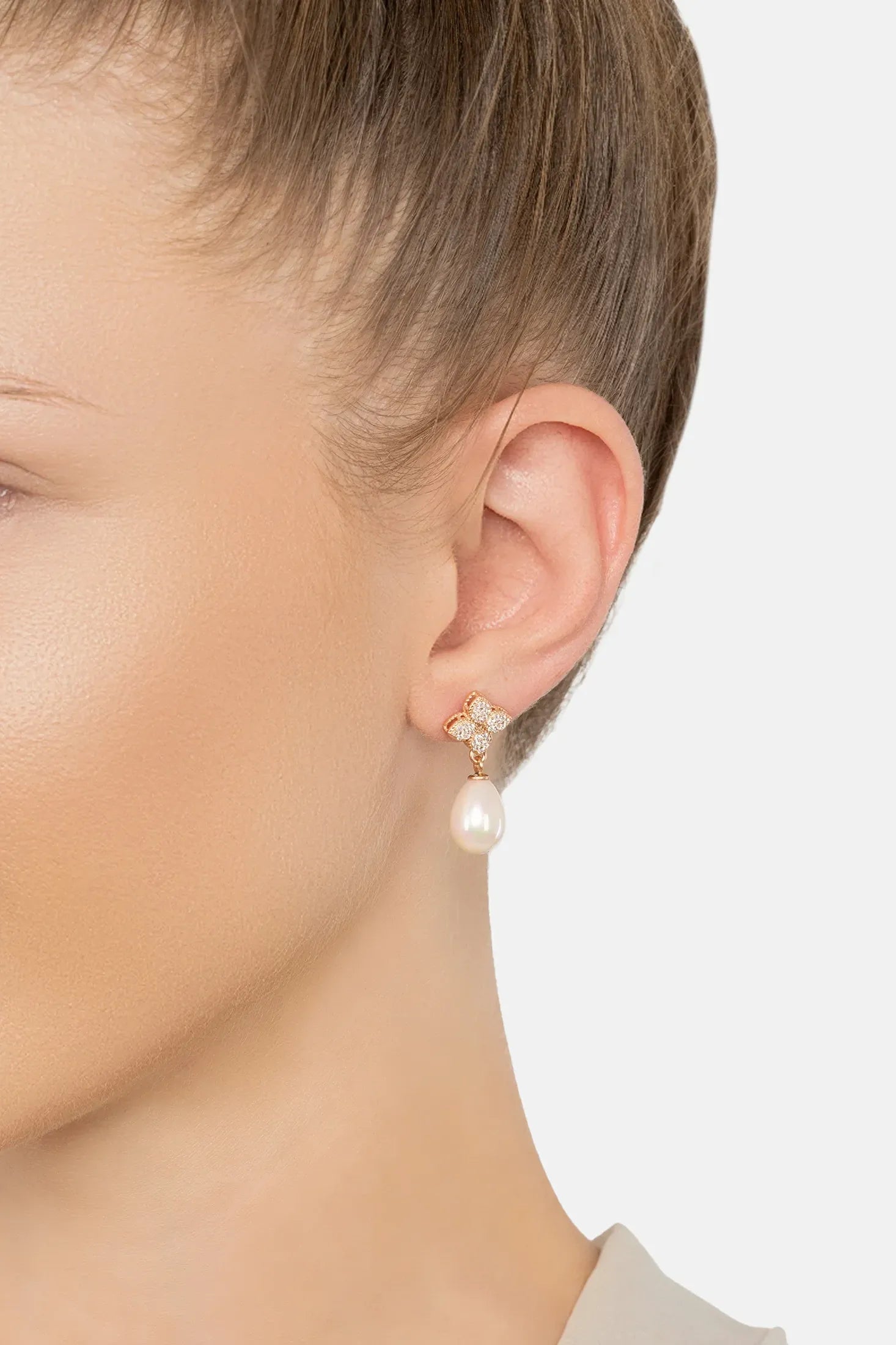 The earring worn by a model.