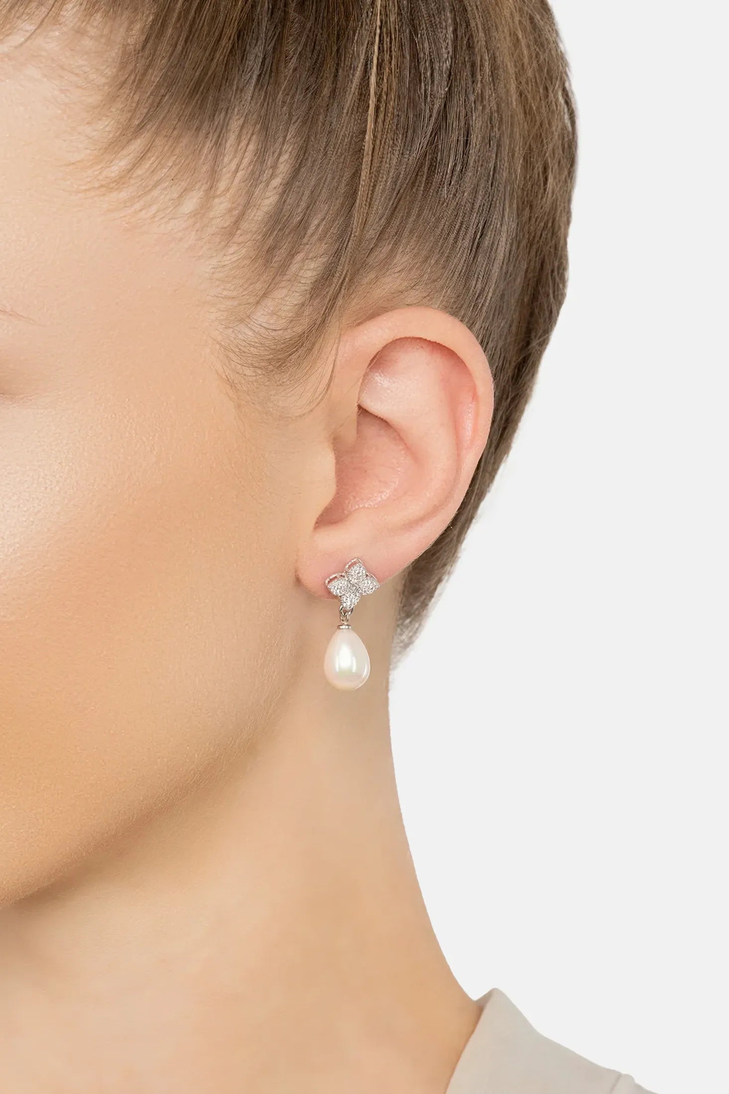 The earring worn by a model.