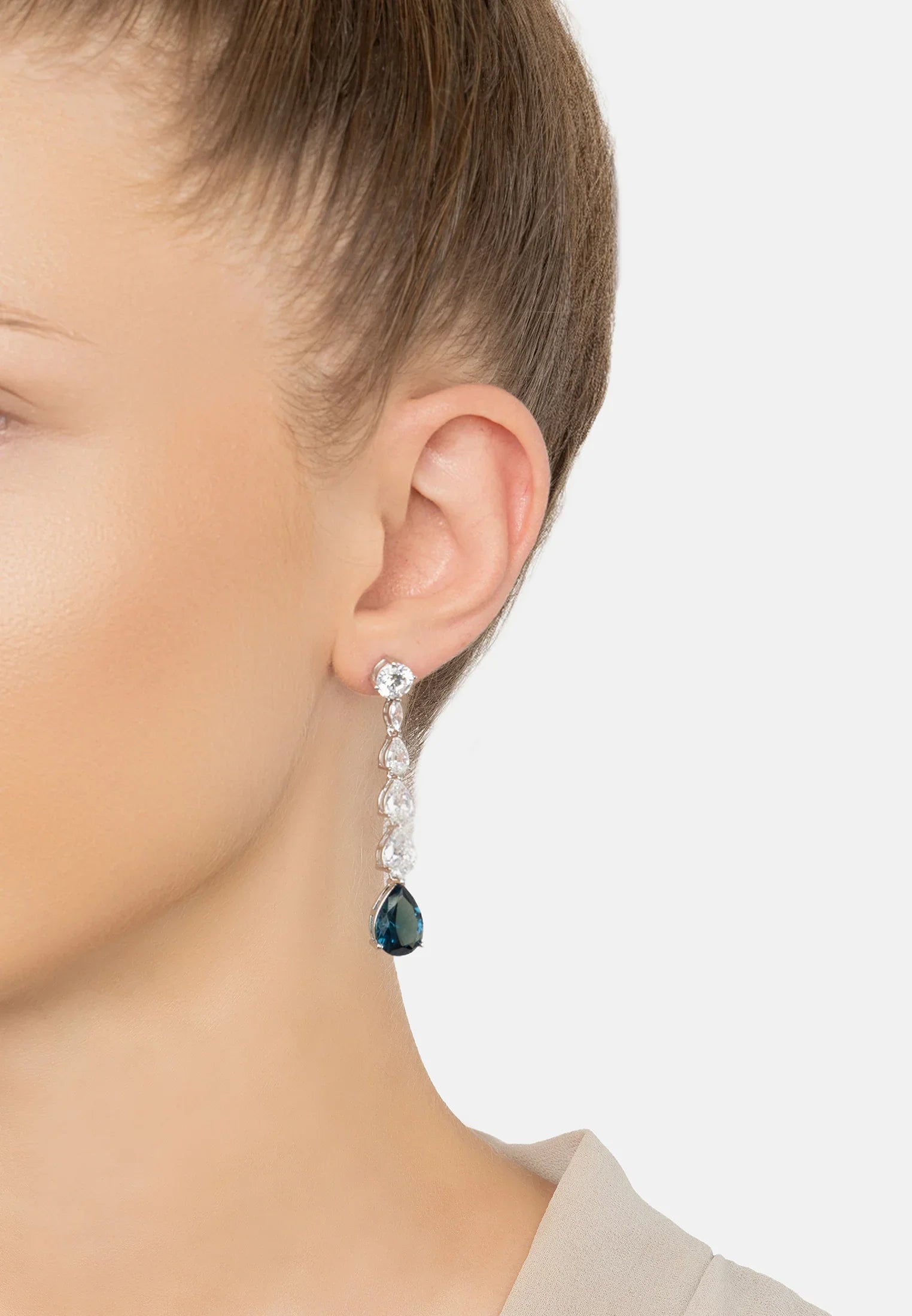 The earring worn by a model.